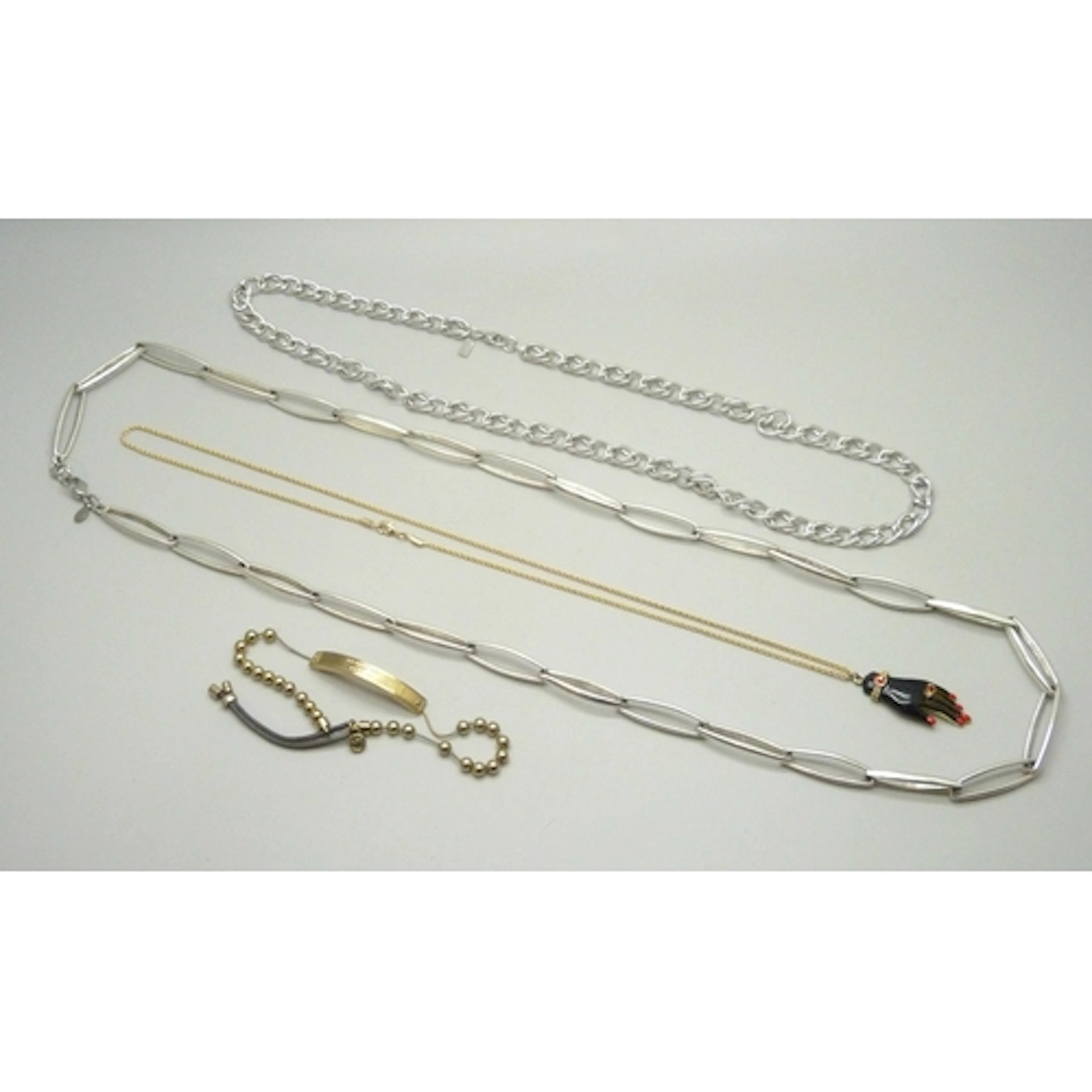 A Butler & Wilson hand pendant, Michael Kors bracelet (a/f) ...
