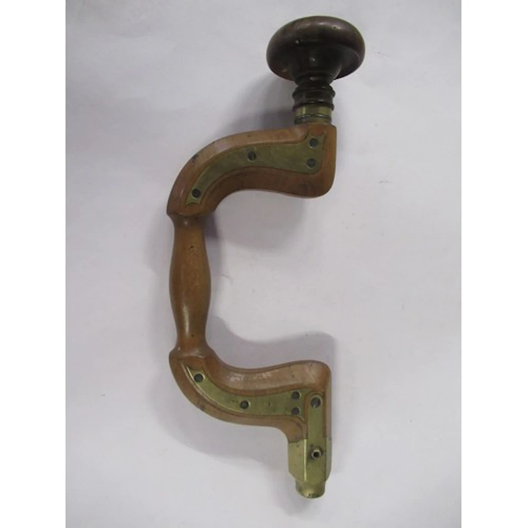 A 19th century wood and brass bit brace or hand drill