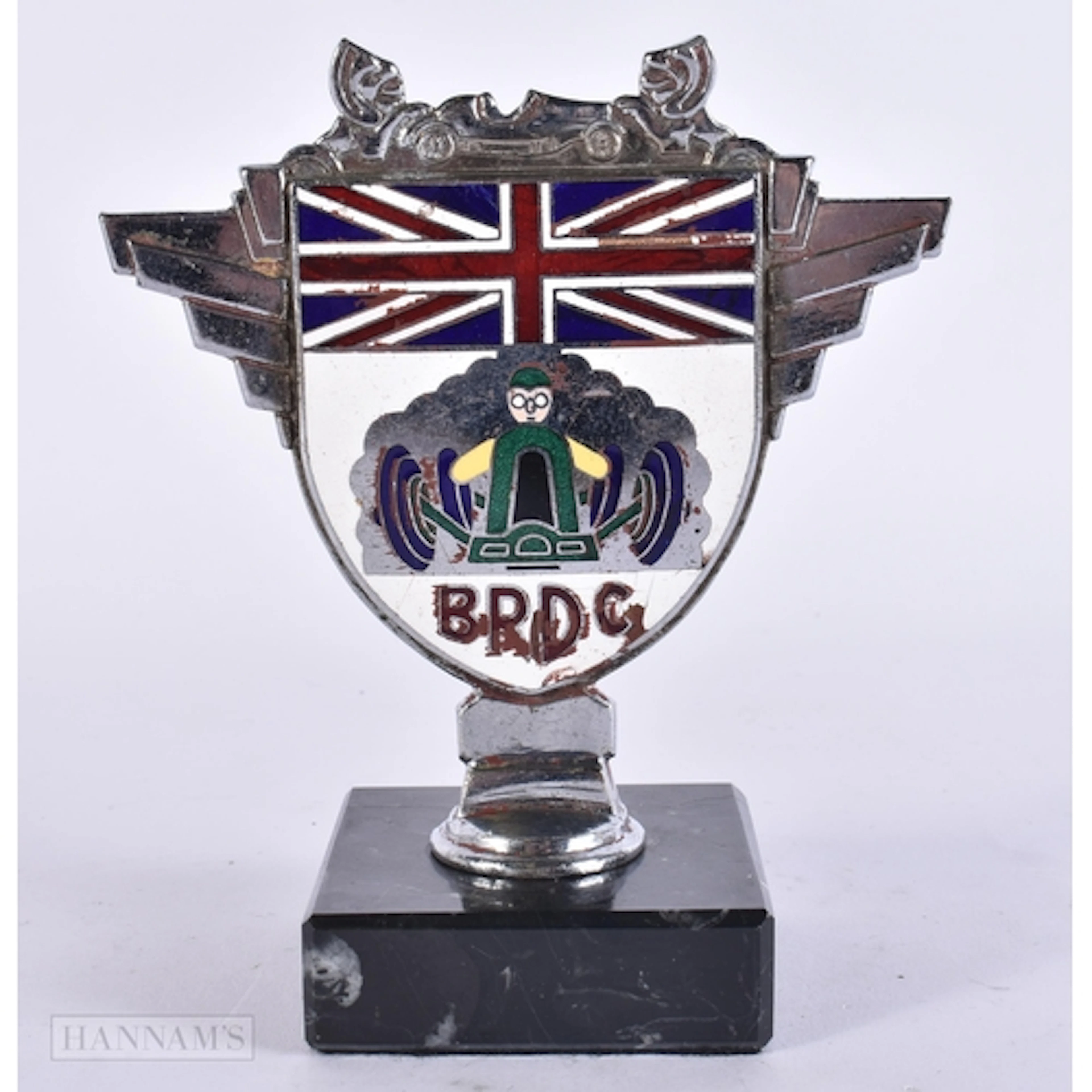 A BRDC ENAMELLED CAR MASCOT. 14.5 cm high.