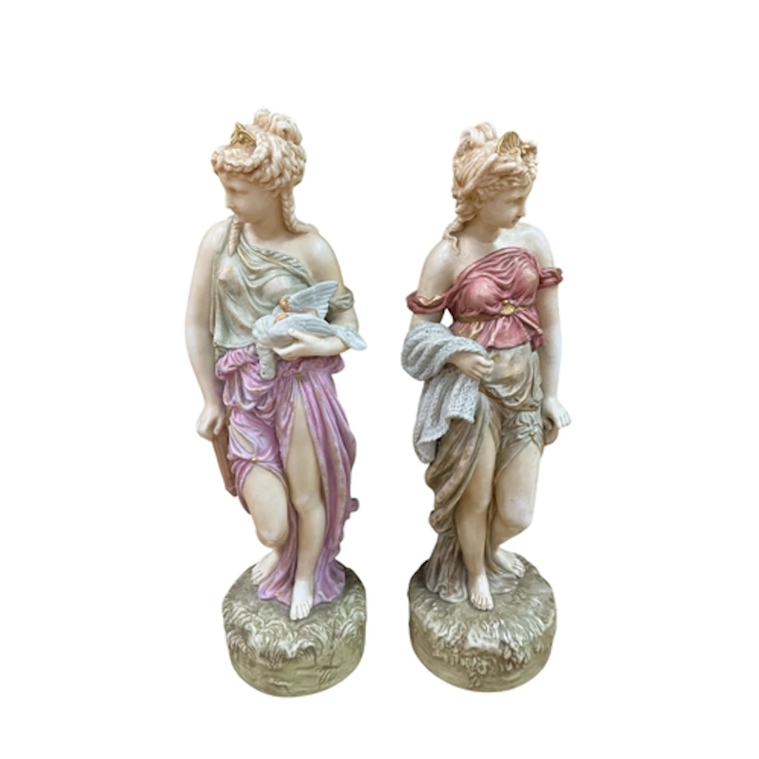 A pair of early 20th century porcelain classical female figu...