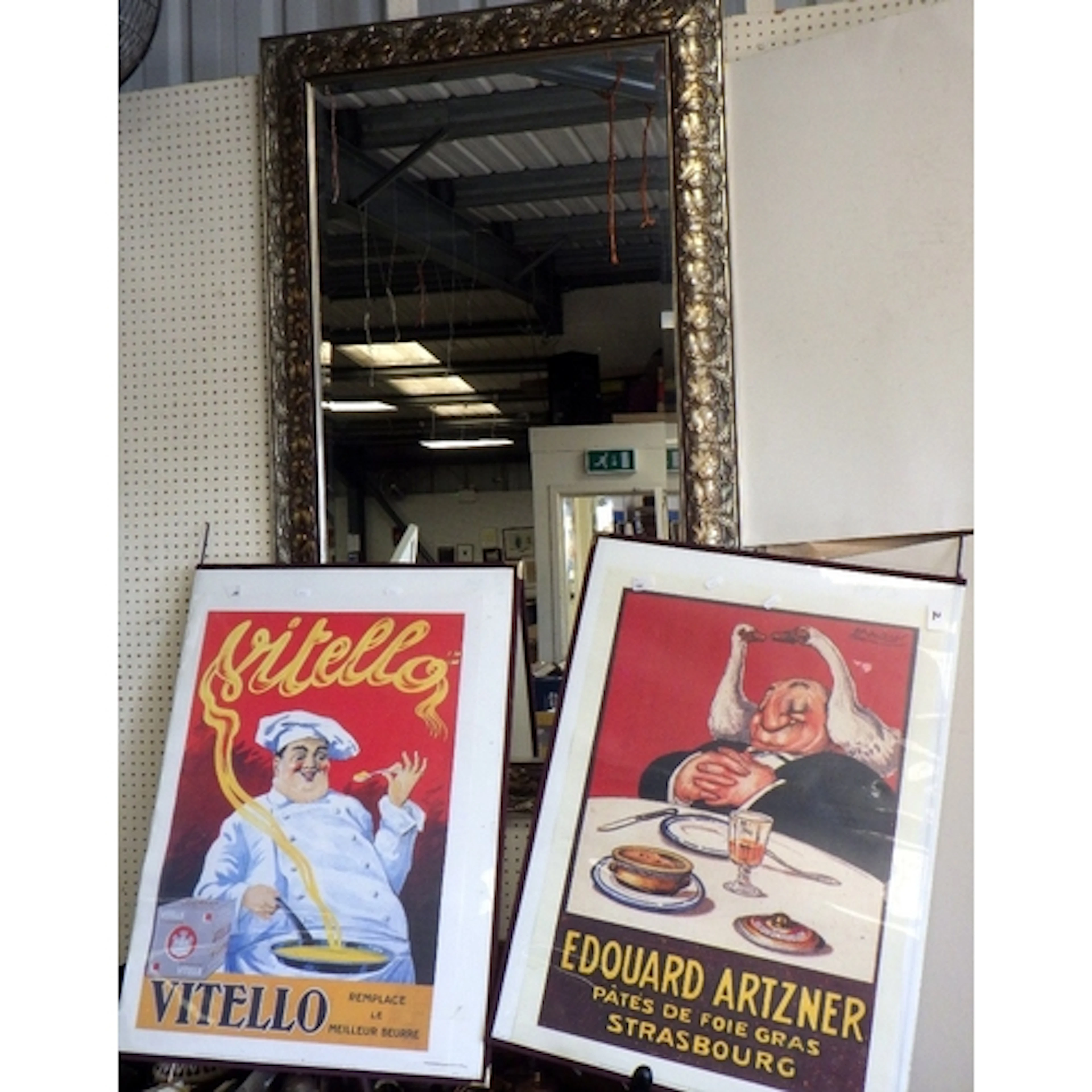 A large modern bevelled mirror together with two modern post...
