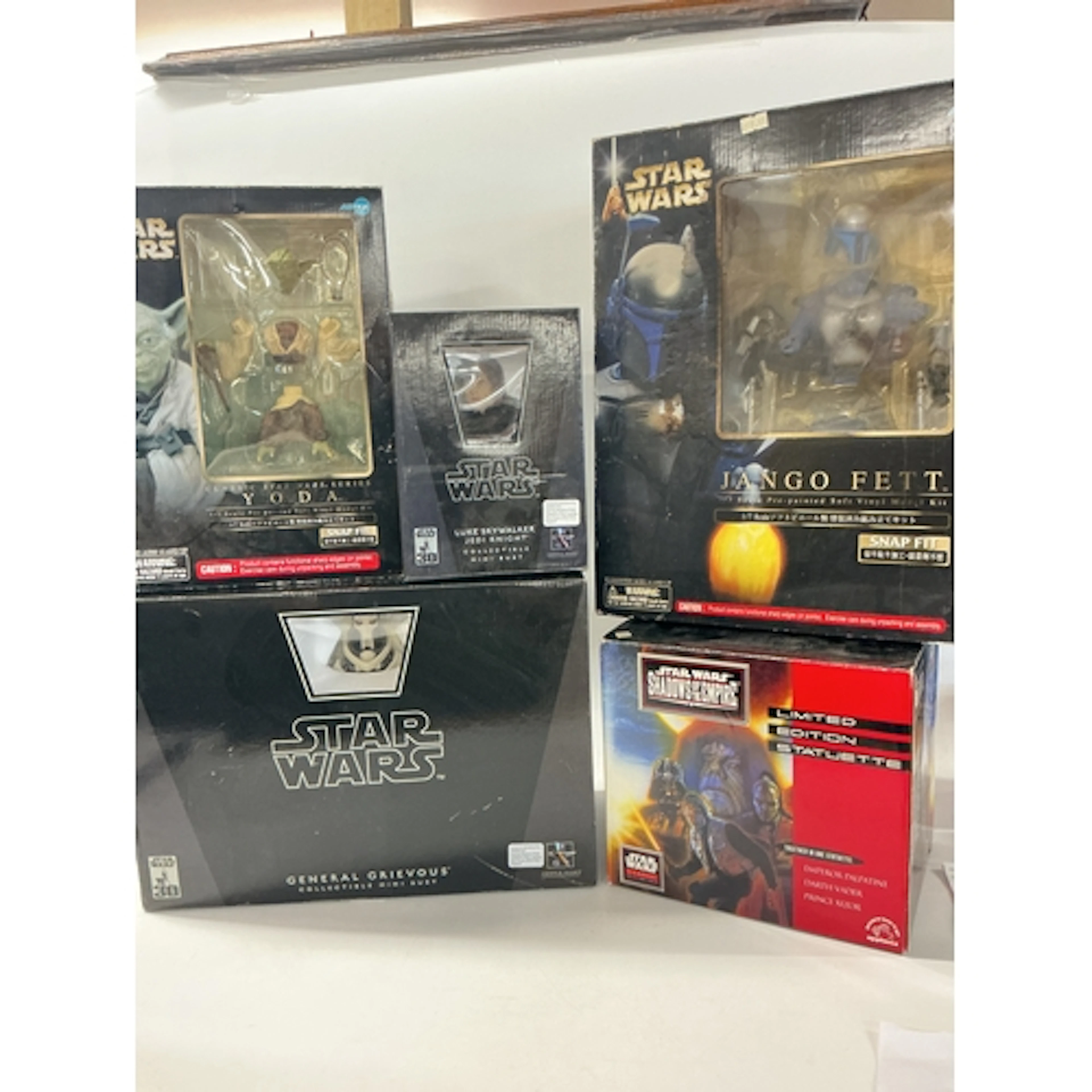 A Collection Of Boxed Star Wars Mini Busts And Snap Fit Kits...