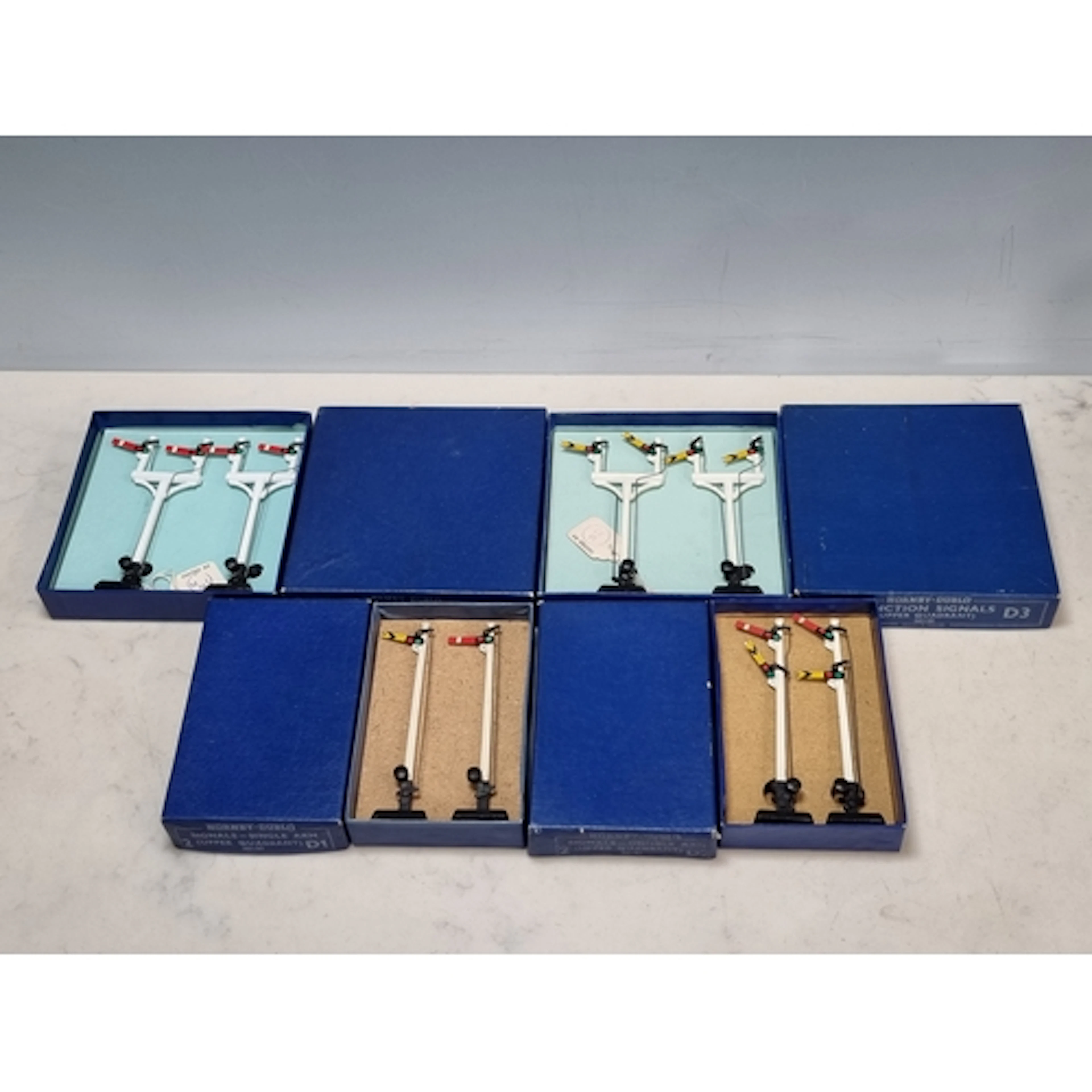 Four Hornby Dublo dark blue boxed Manual Signals, comprising...