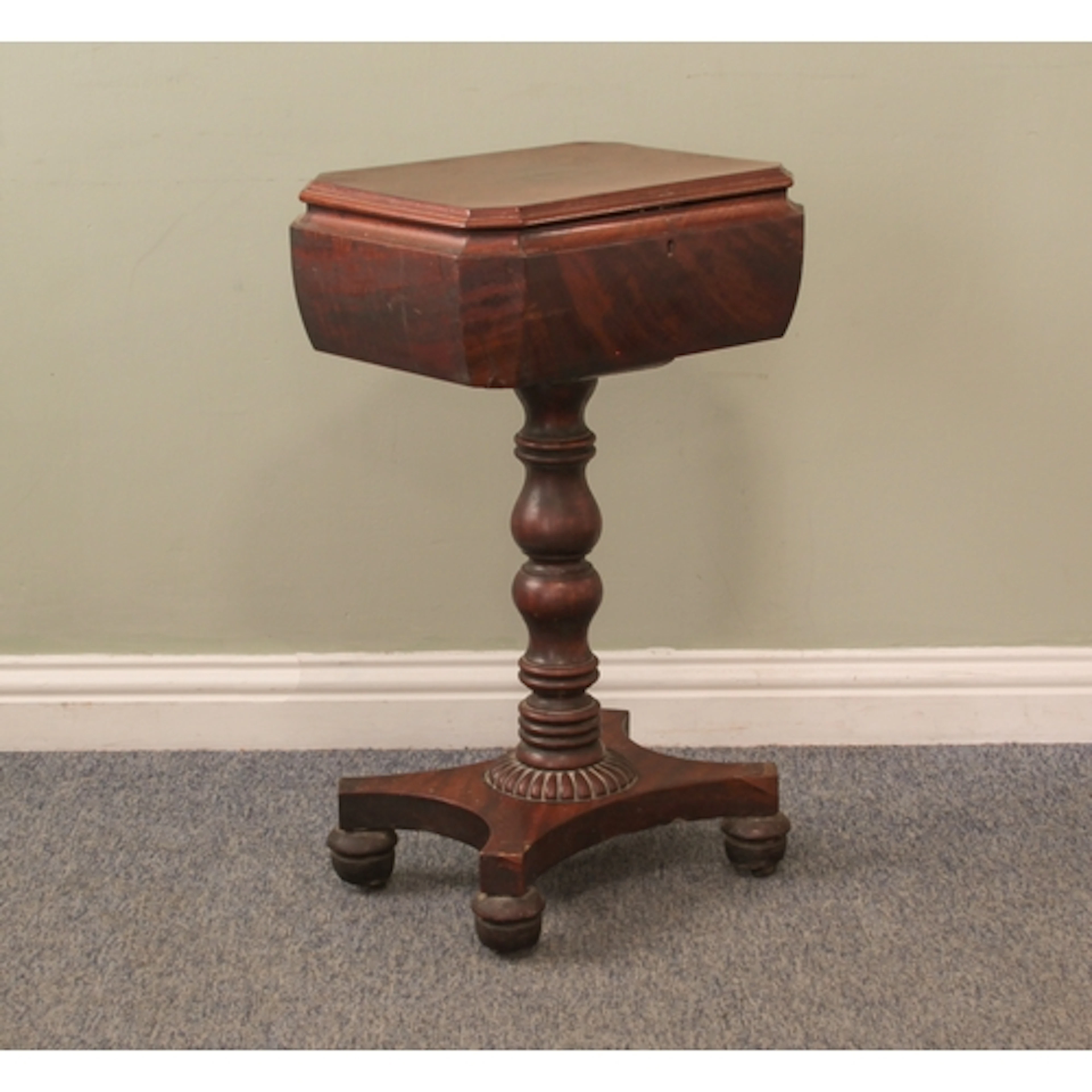 A mid-19th century mahogany teapoy - the sarcophagus top wit...