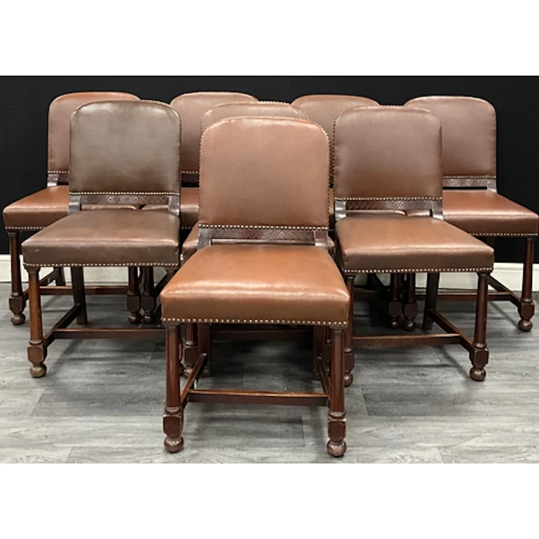 A set of eight early 20th century dining chairs, reddish lea...