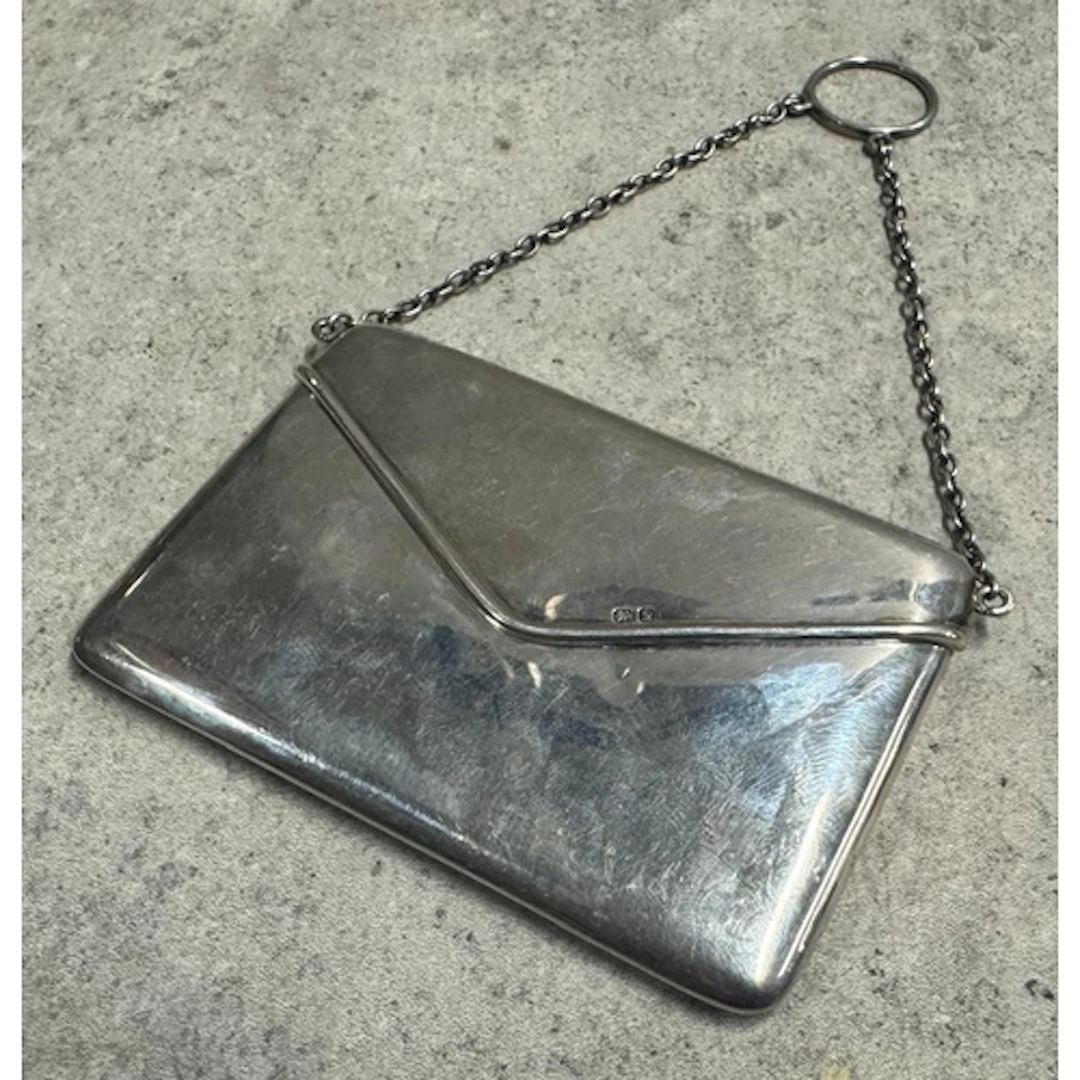 A novelty silver card case in the form of an envelope. Chest...
