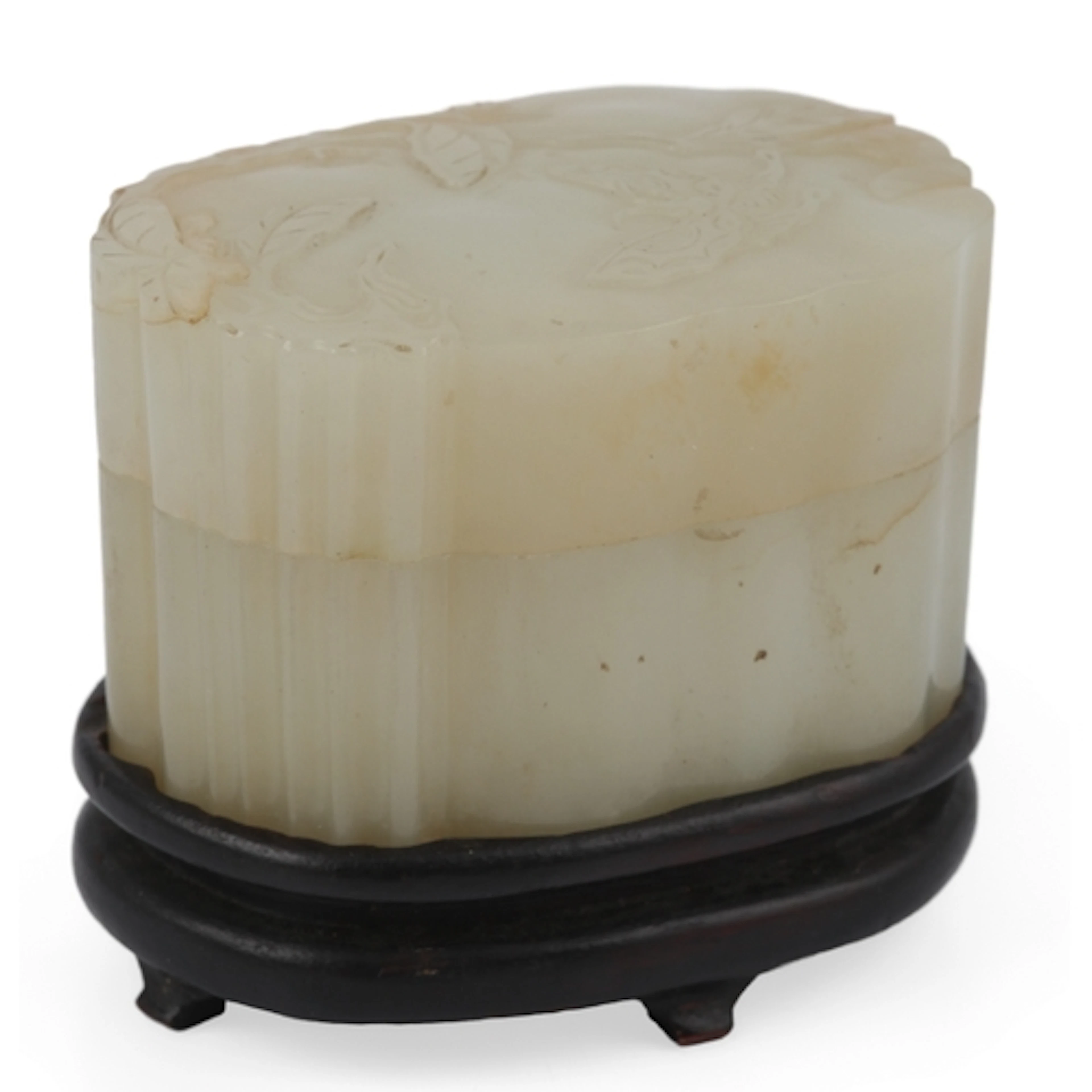 A Chinese white and russet jade box and cover, 18th / 19th c...