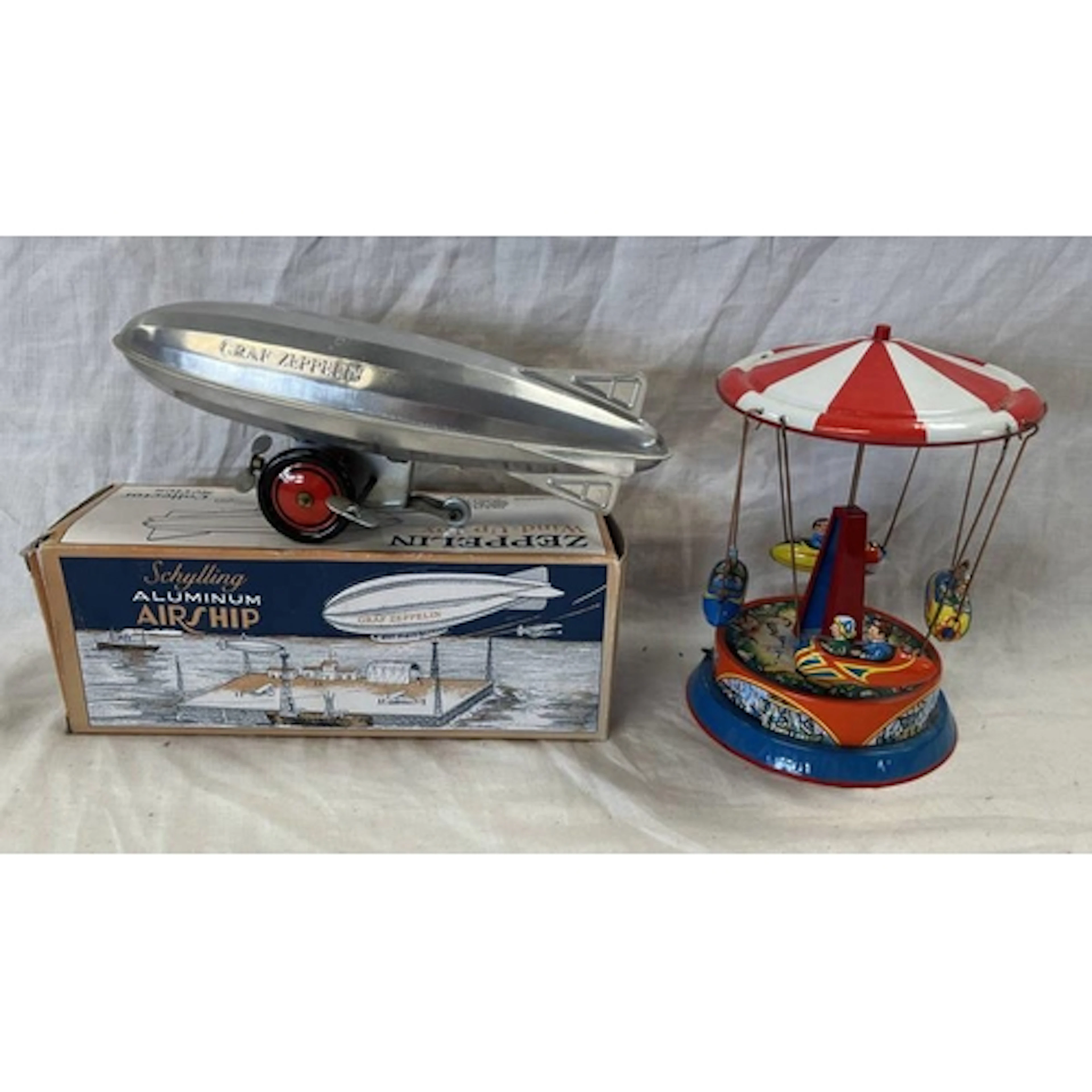 TIN PLATE WEST GERMAN CAROUSEL TOY TOGETHER WITH SCHYLLING W...