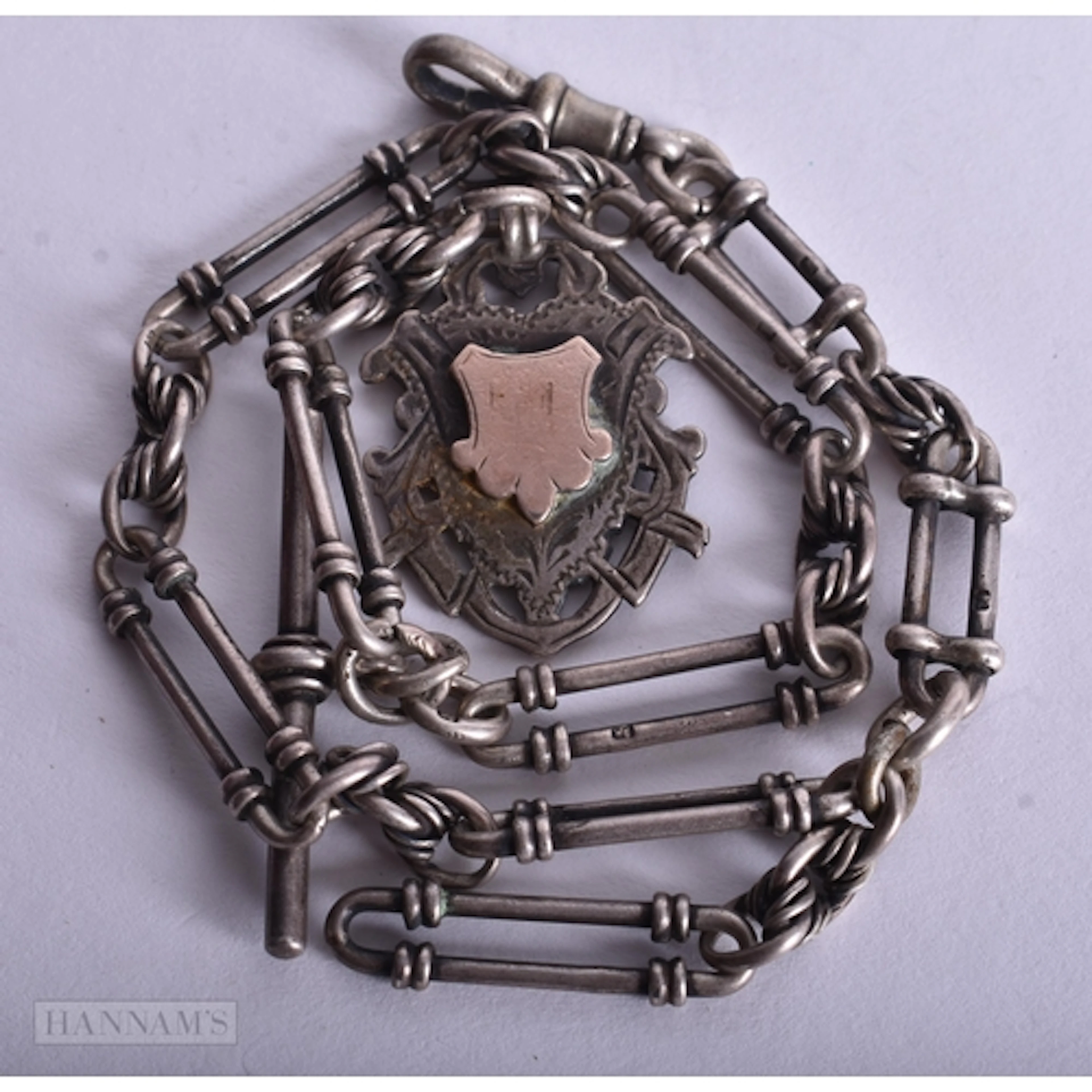 Antique Sterling Silver Watch Chain w/ Fob (47g). 34 cm wide...