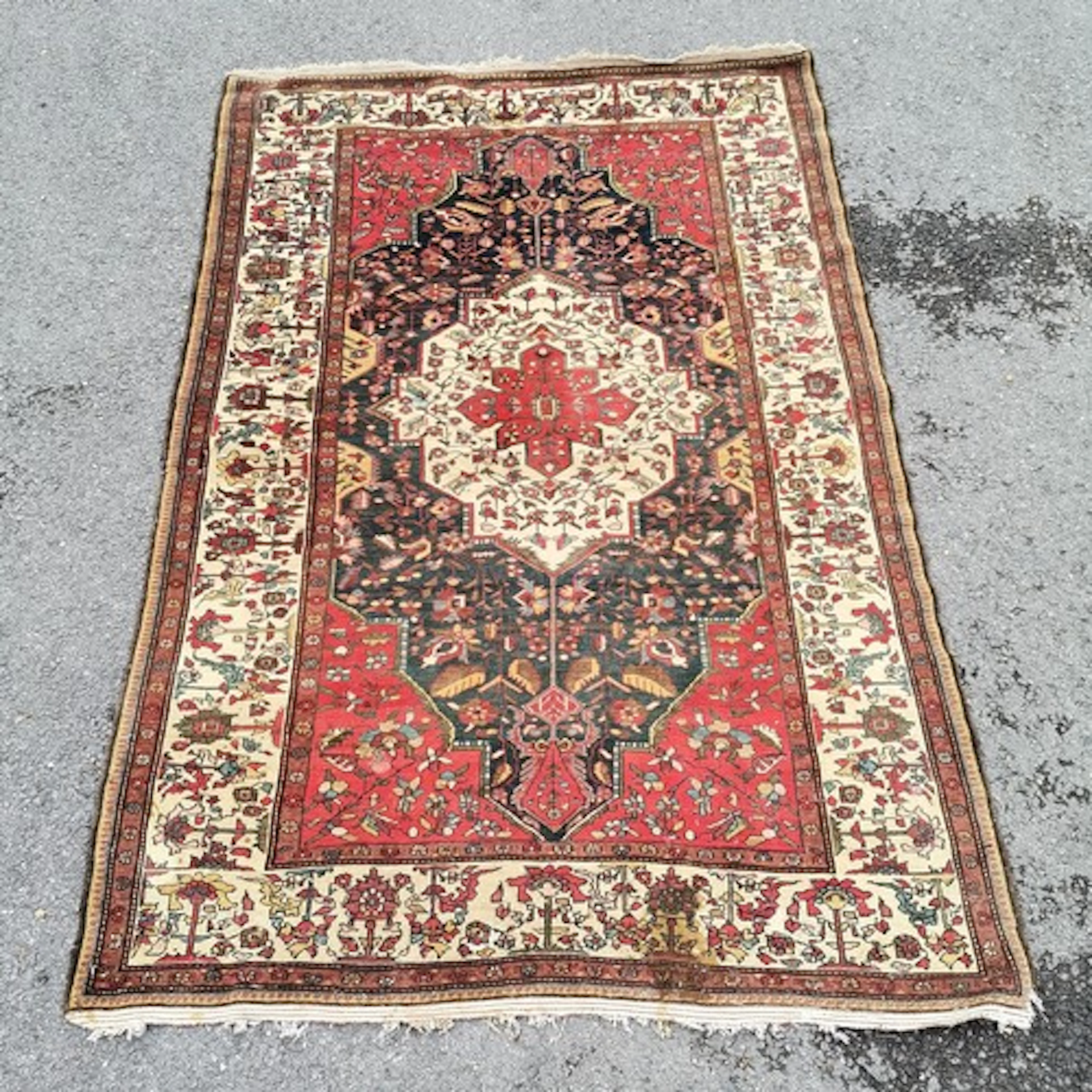 Fine antique rug - has some staining and wear - 136cm x 212c...