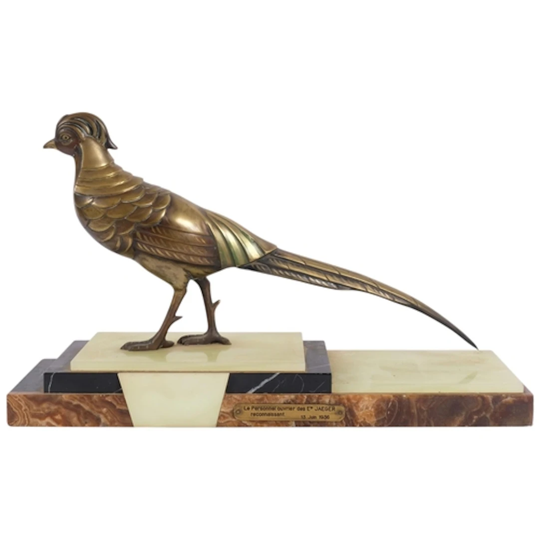 An Art Deco patinated bronze figure of a pheasant, on steppe...