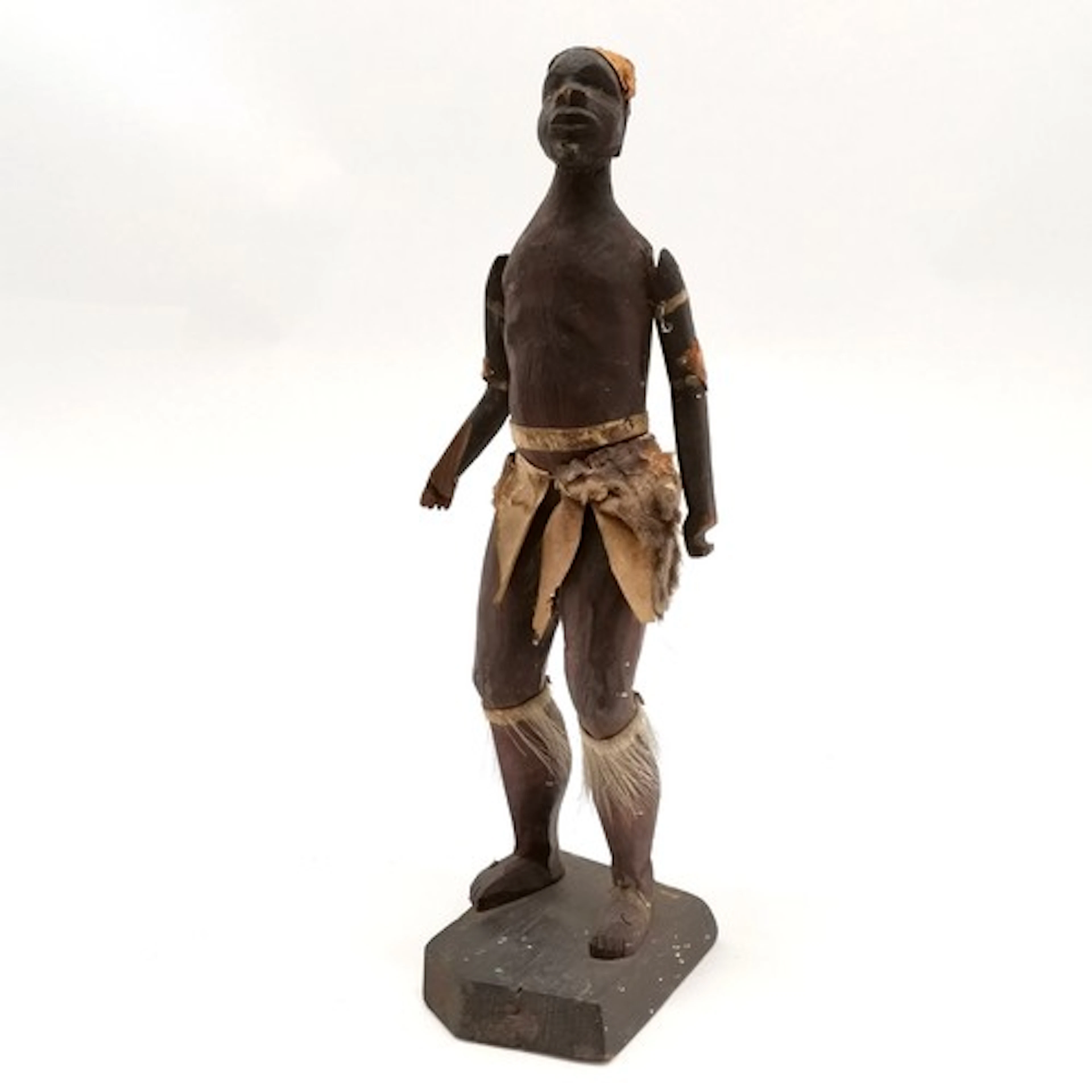 Antique ethnographical African hand carved figure with cloth...