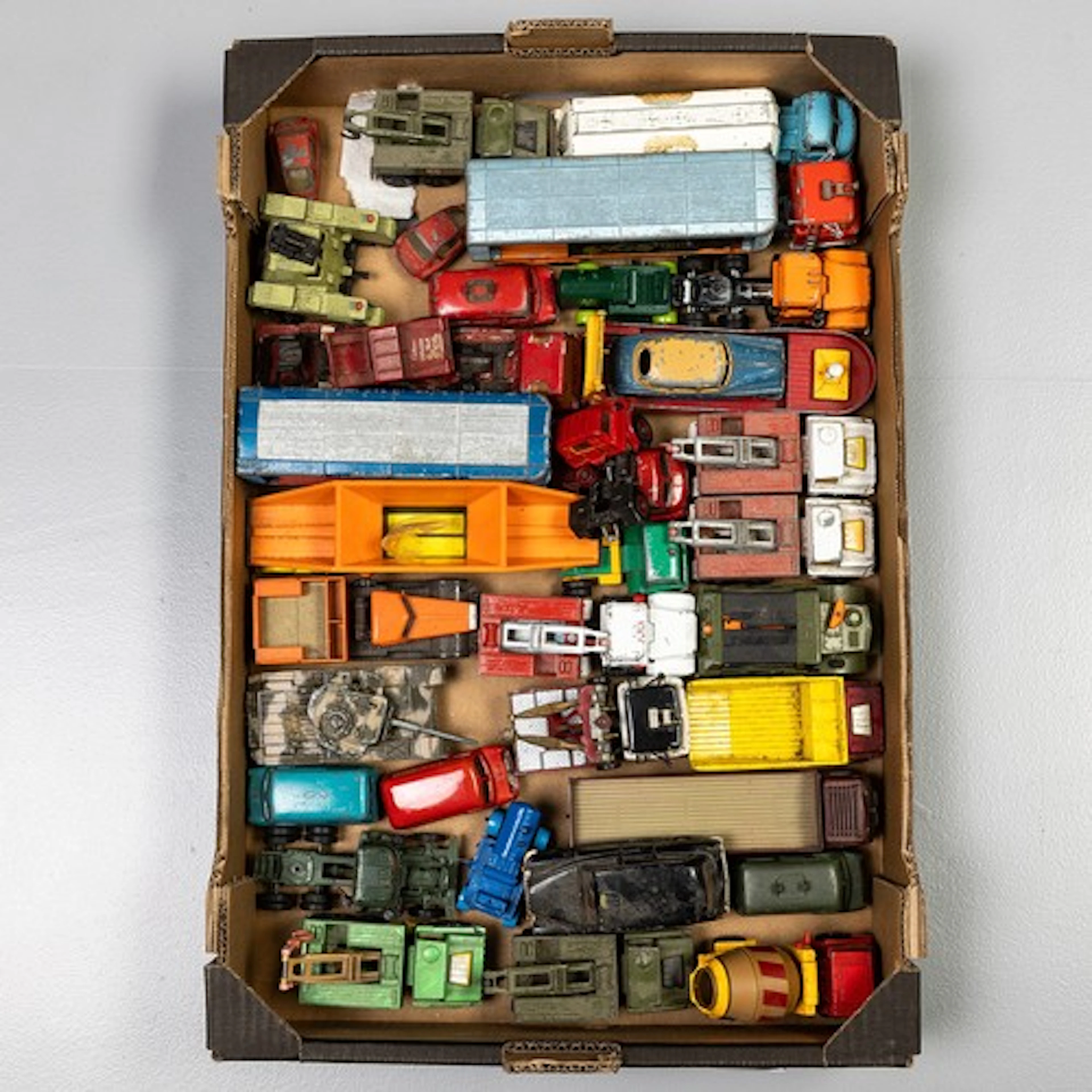 Fruit tray containing unboxed playworn Corgi/Dinky and Match...