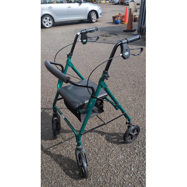 Folding mobility rollator in green-painted tubular metal.