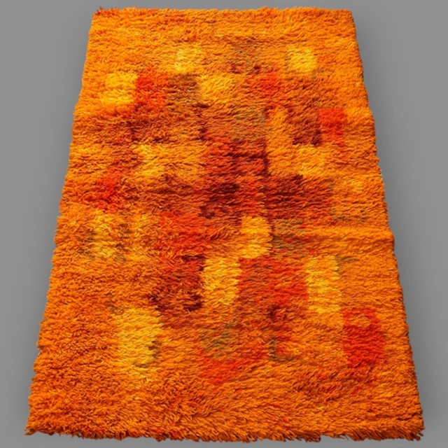A modern orange-ground tufted rug, of a mid-century Scandina...