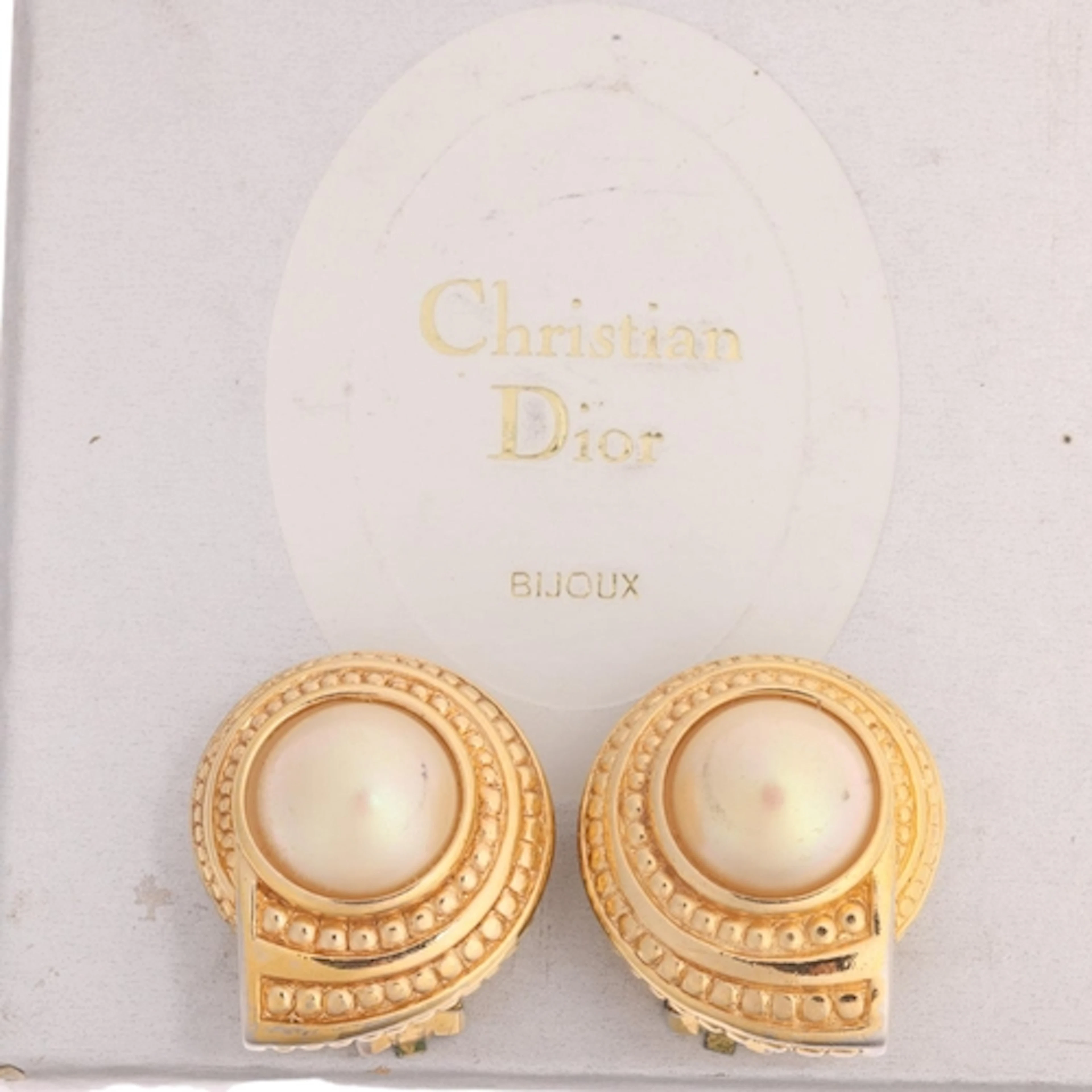 CHRISTIAN DIOR - a pair of gilt-metal faux pearl 'Shell' cli...