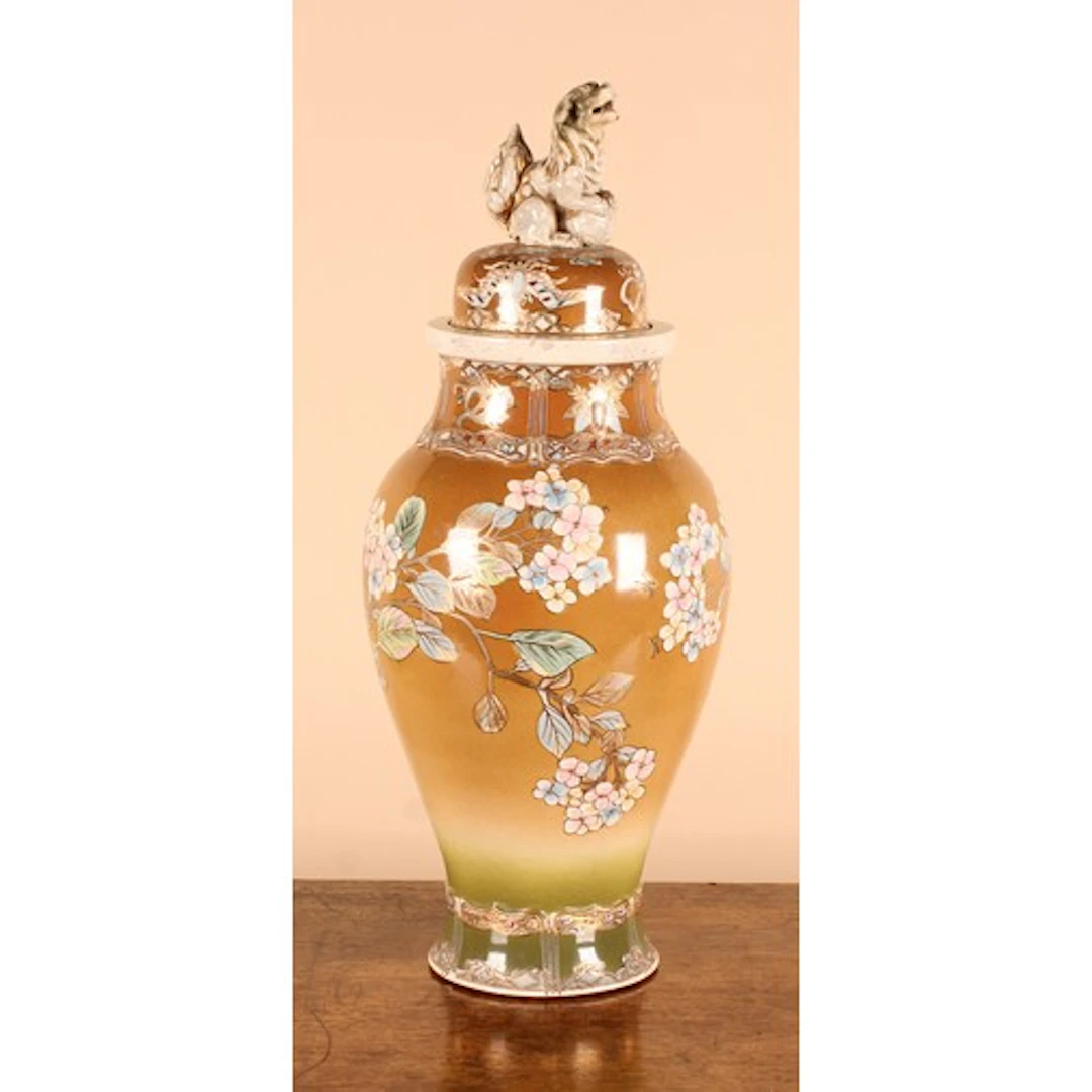 A Japanese Meiji period Satsuma vase and cover, fu dog finia...