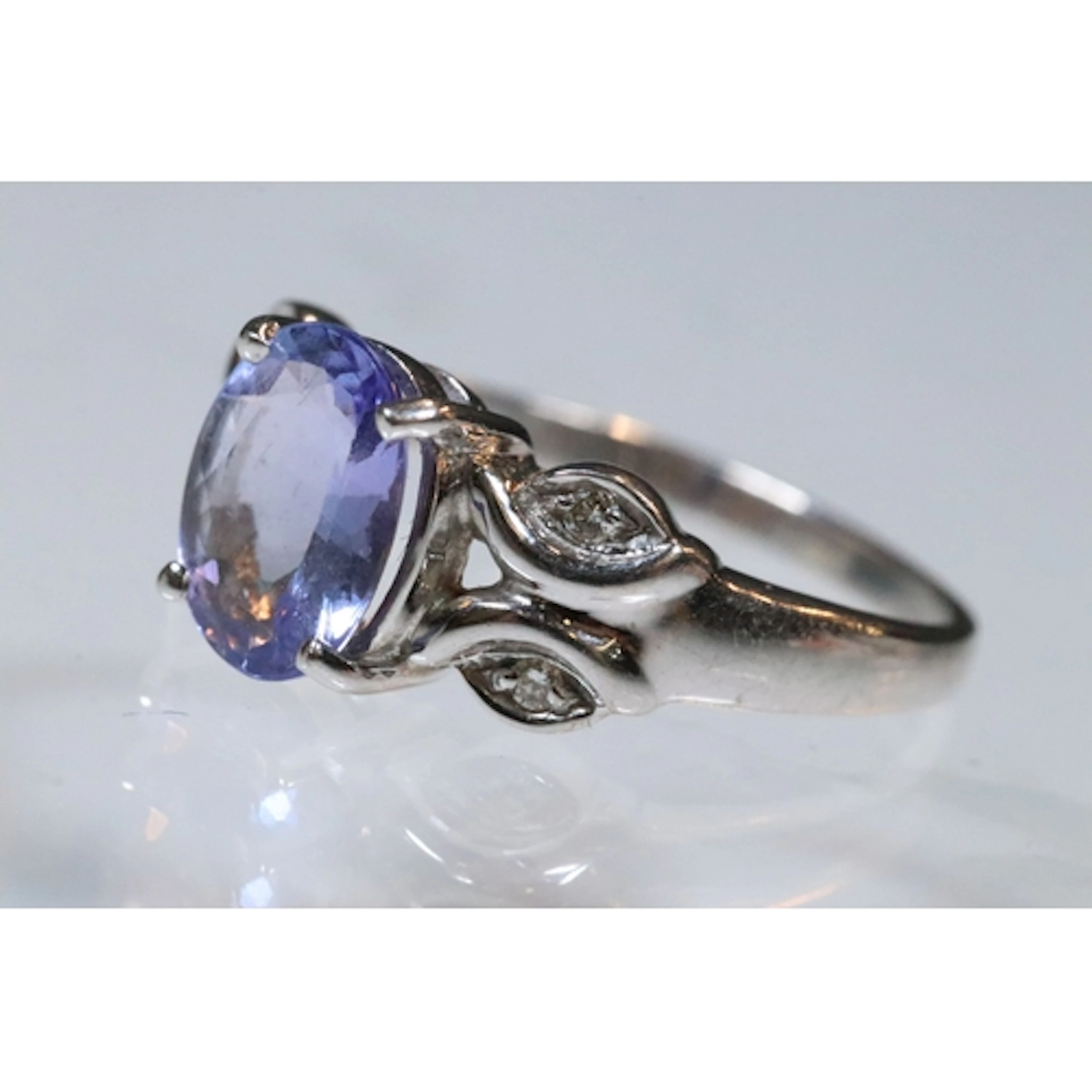 18ct gold, tanzanite and diamond ring. The ring being set wi...
