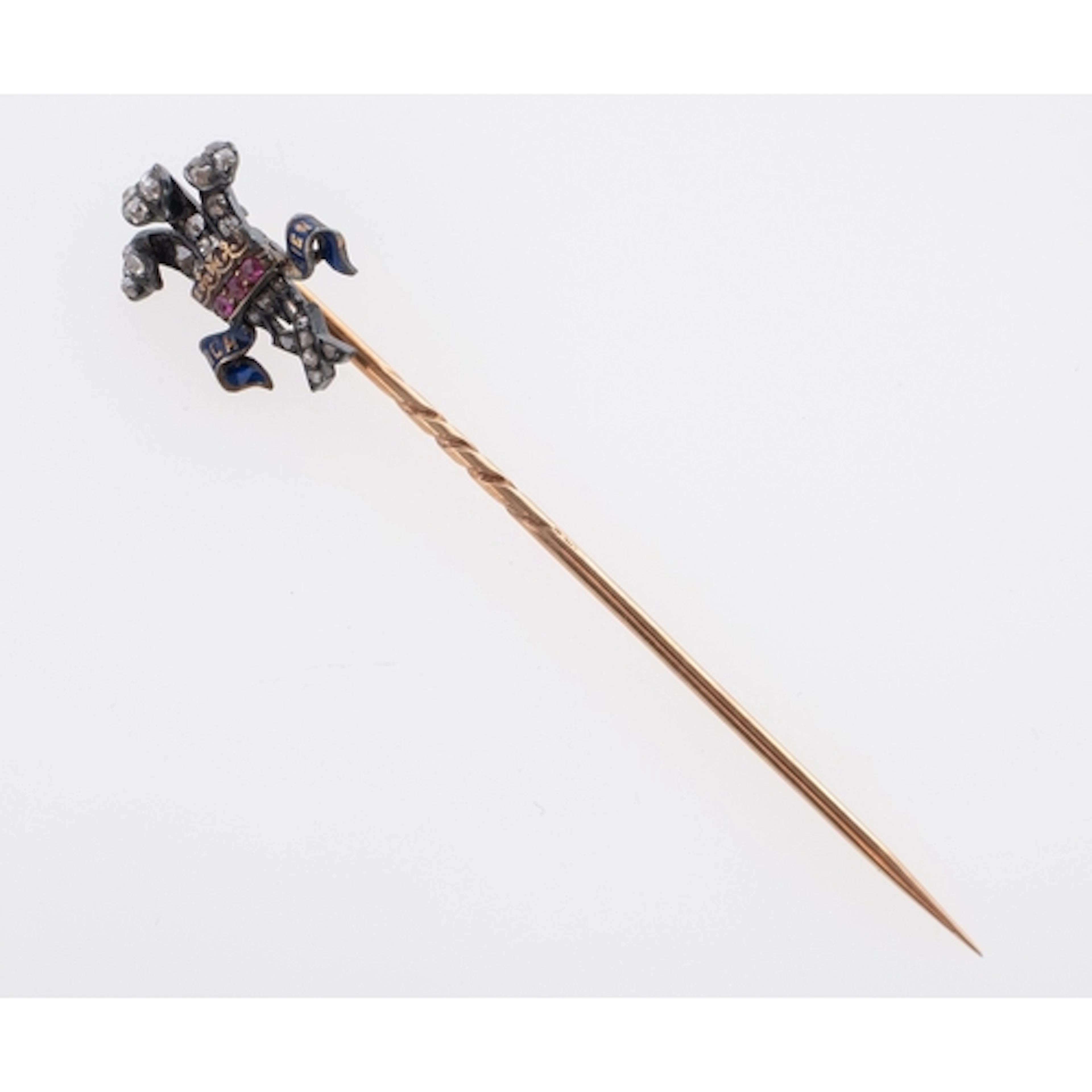 A diamond and ruby set Prince of Wales stickpin in fitted Ga...