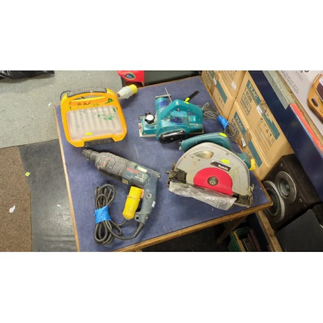 A group of 110V equipment comprising a Makita 5704R circular...