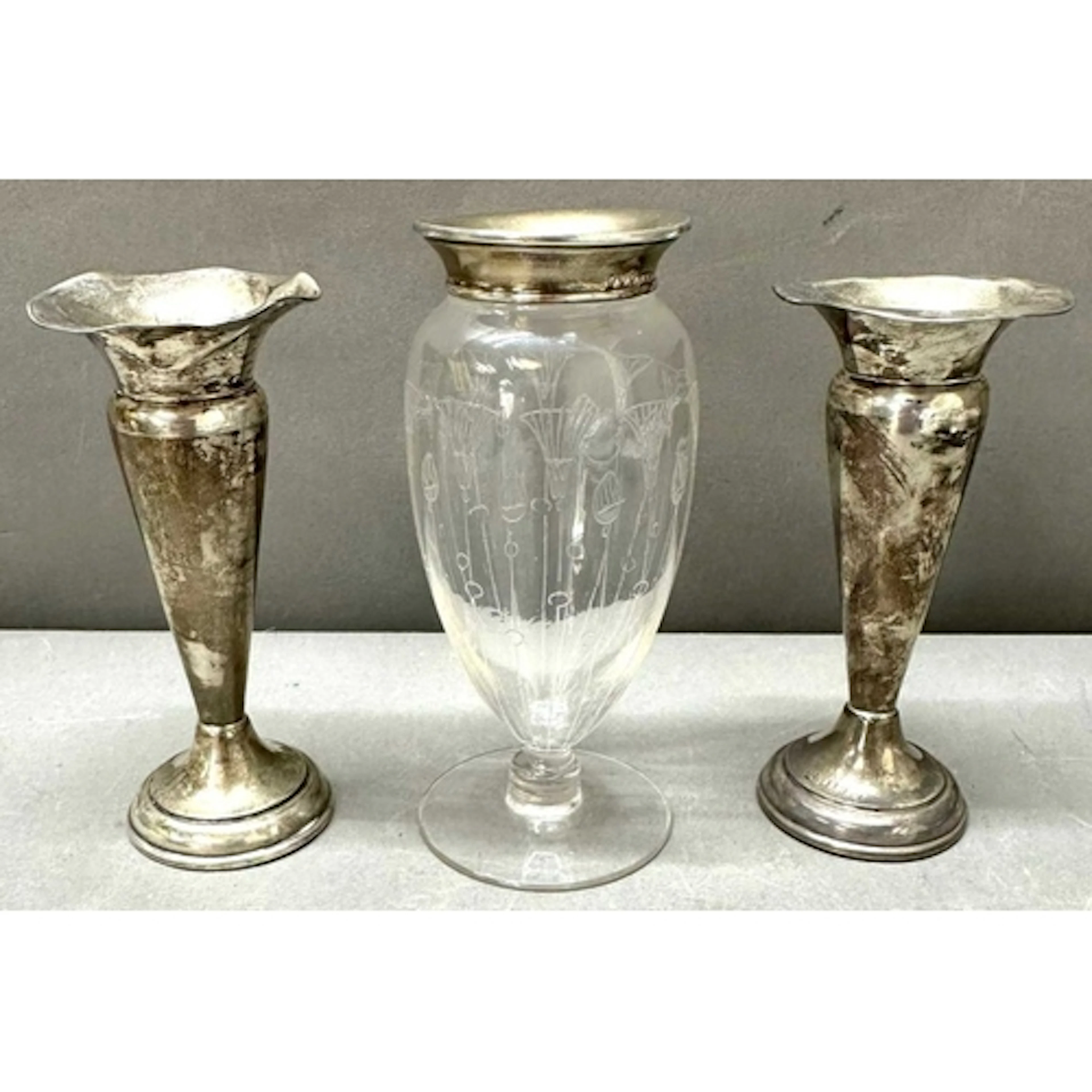 A pair of silver trumpet vases with ruffled edges, hallmarke...