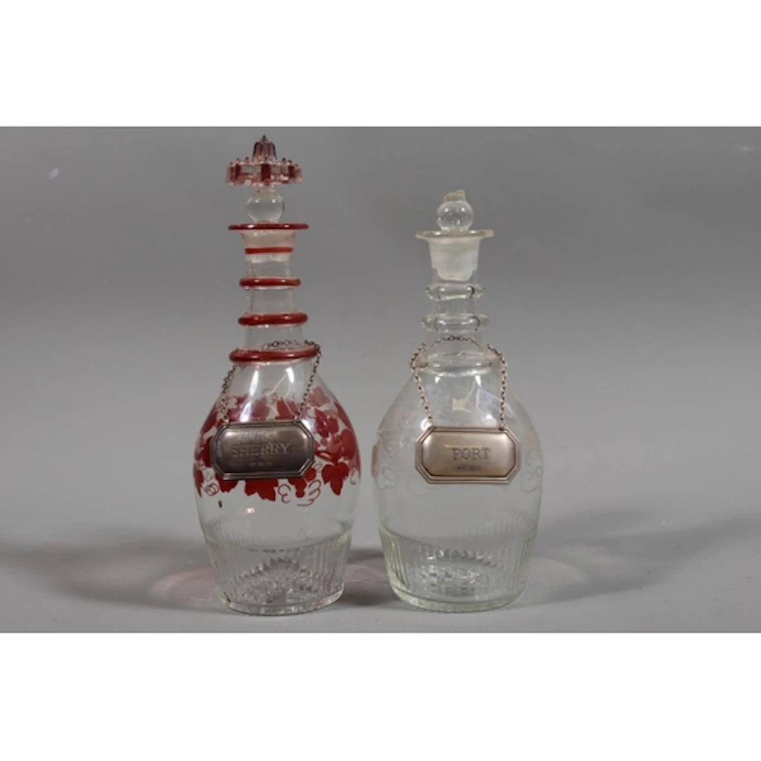 Two 19th century decanters and a pair of silver port and she...