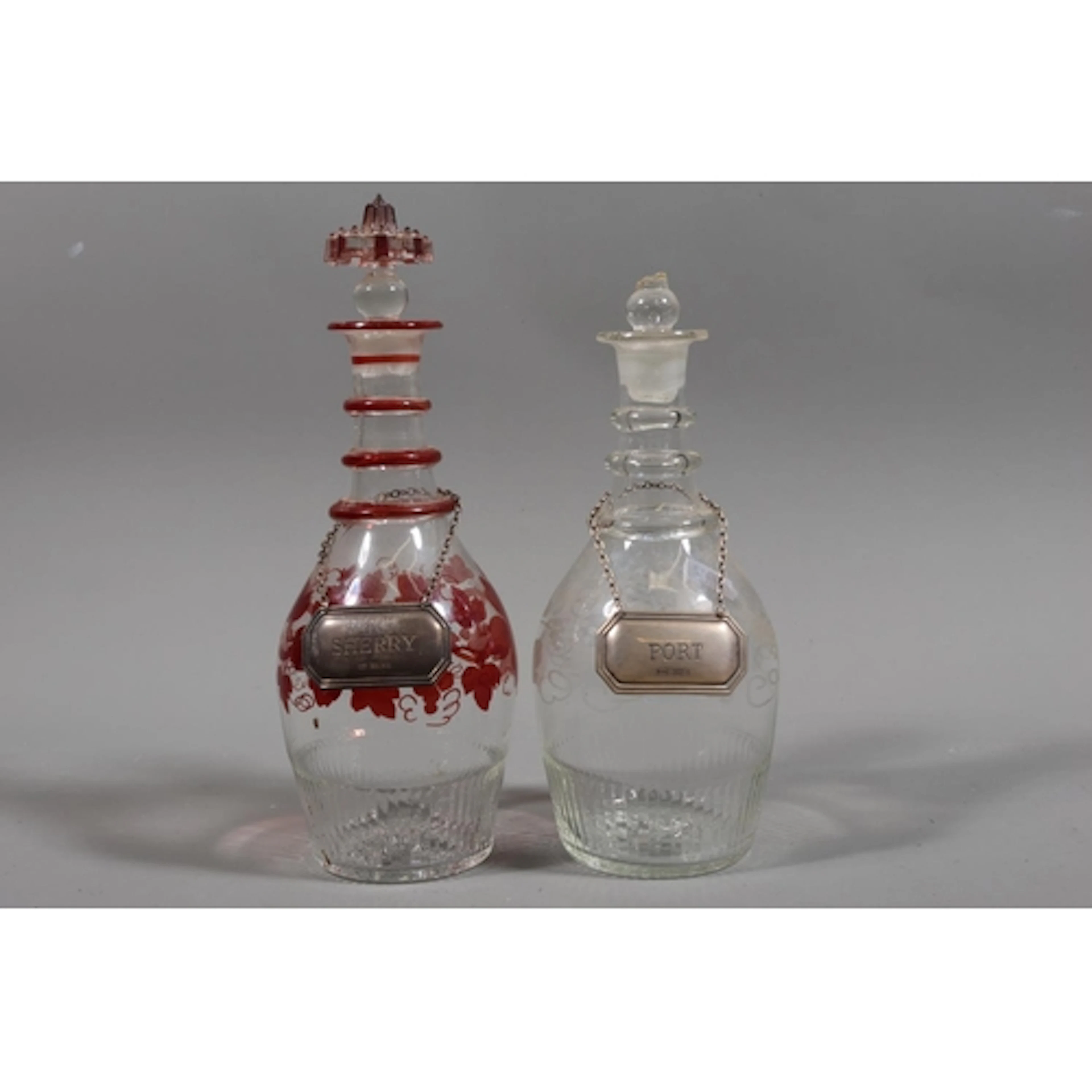 Two 19th century decanters and a pair of silver port and she...