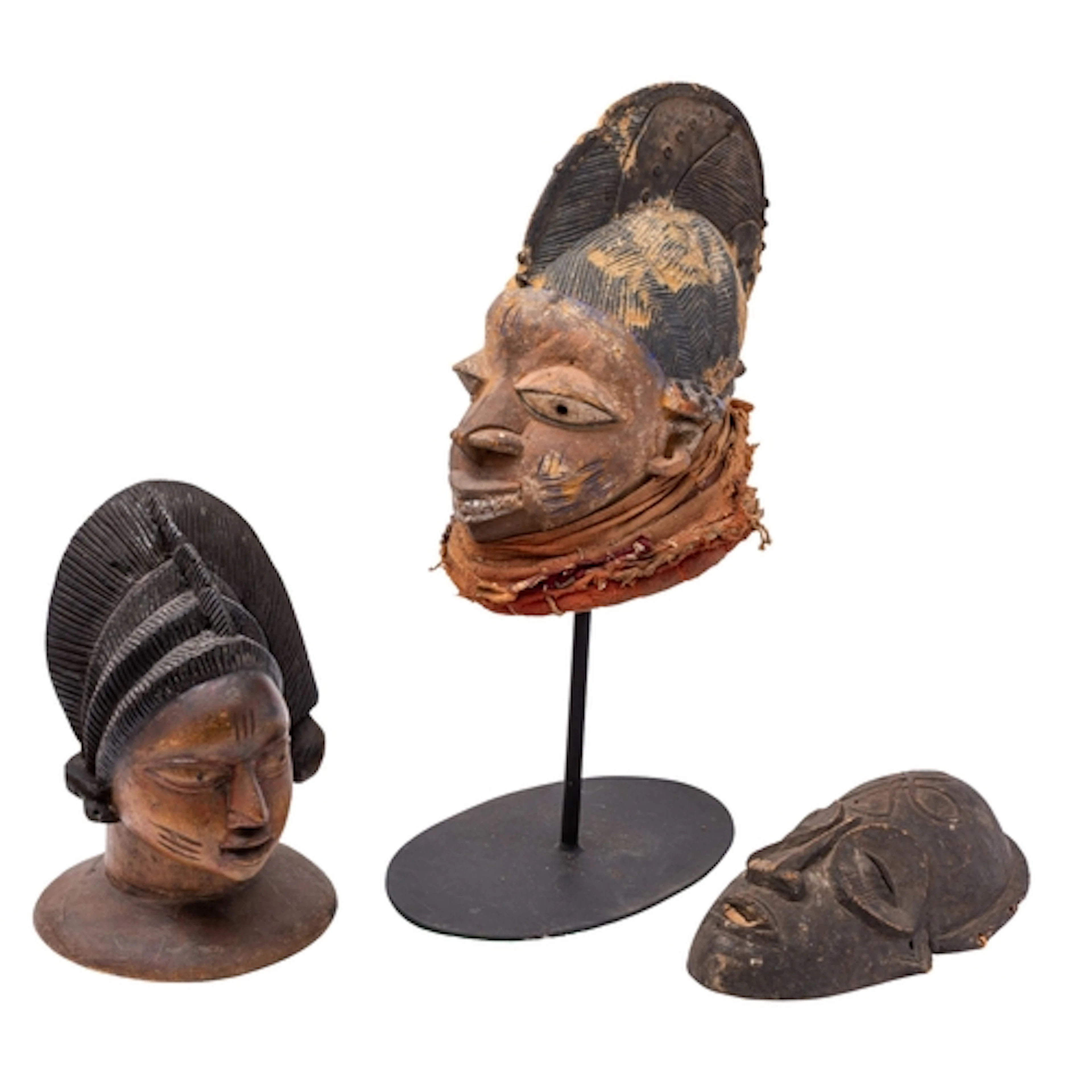 A carved and partially painted wood headdress 'Egungun' in t...