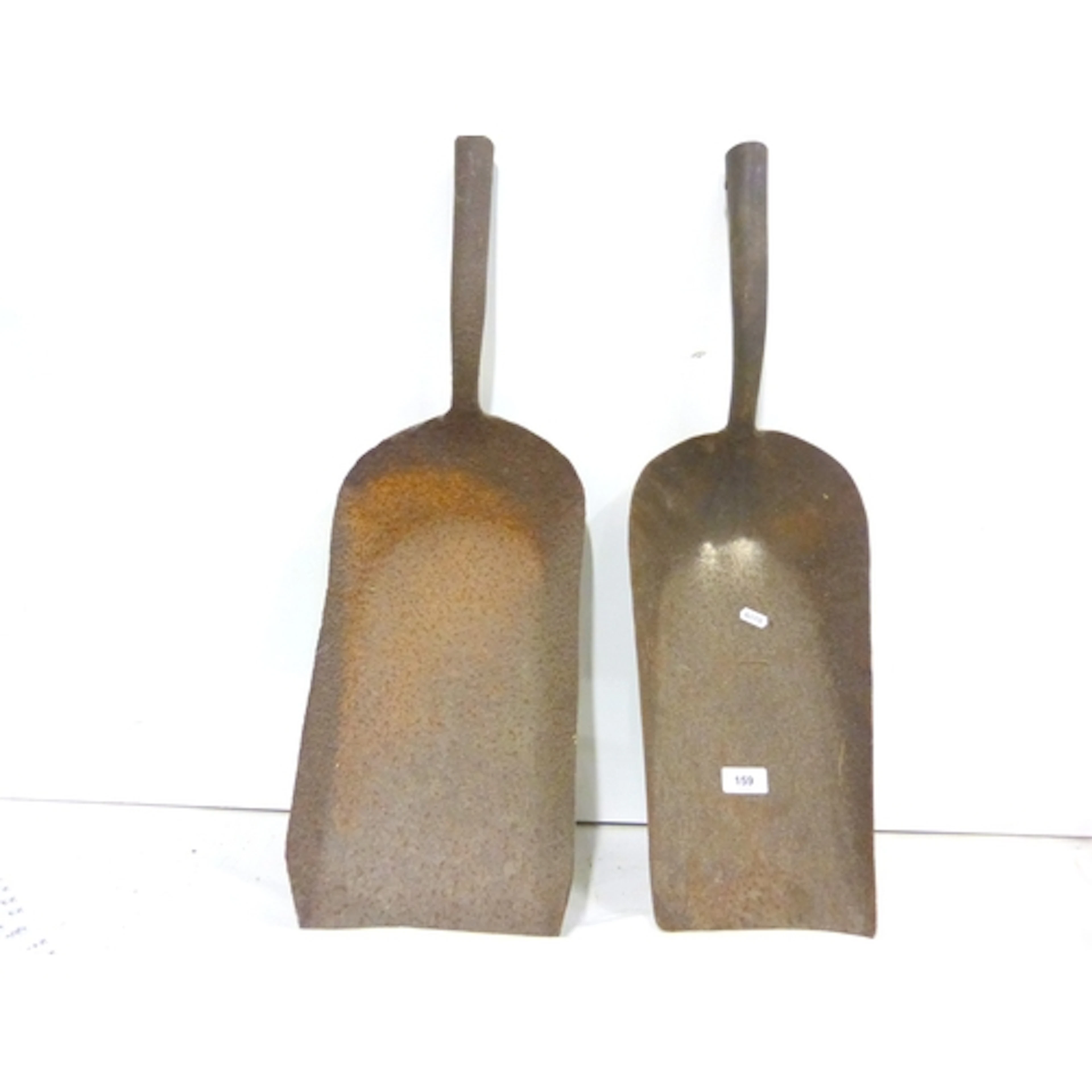 Two antique steam train coal shovels.