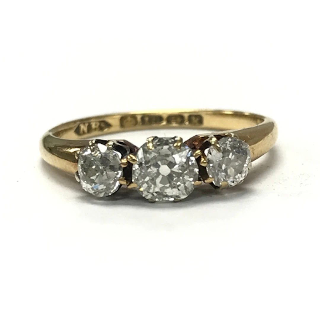 An 18ct gold diamond trilogy ring, 2.8g total weight size L/...