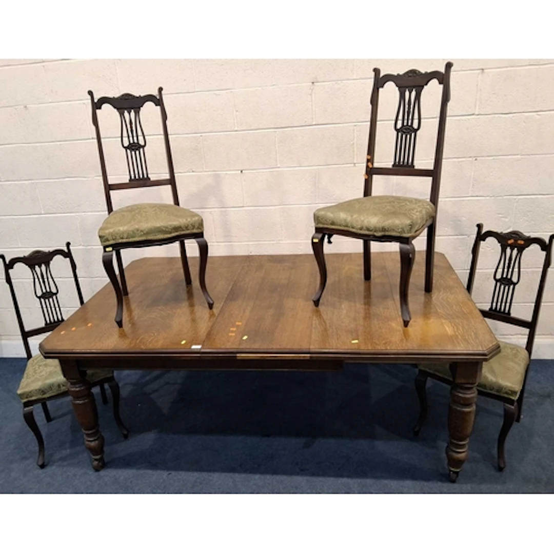 AN EARLY 20TH CENTURY OAK WIND OUT DINING TABLE, with one ad...