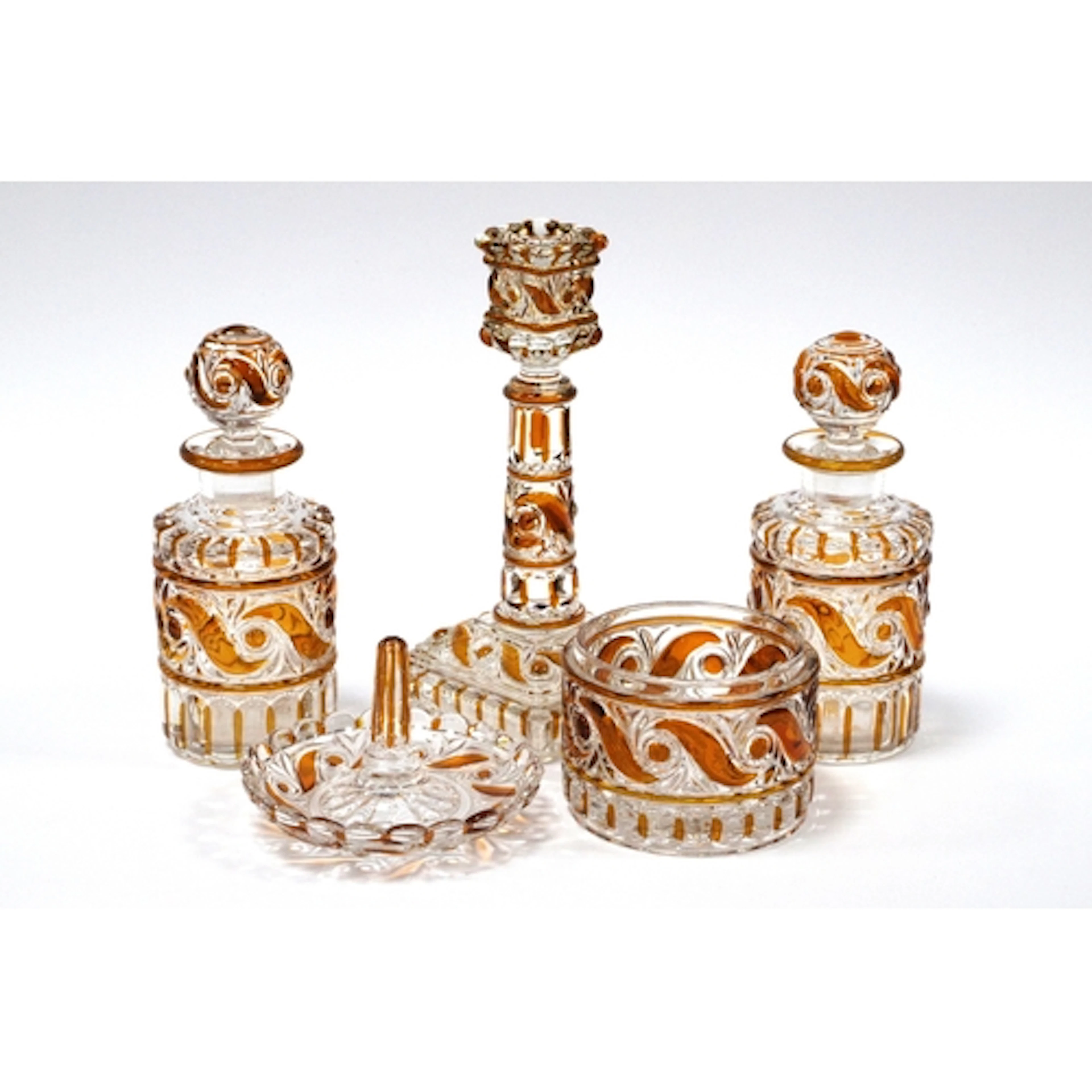 A Baccarat Glass Part Dressing Table Set, the amber flashed ...