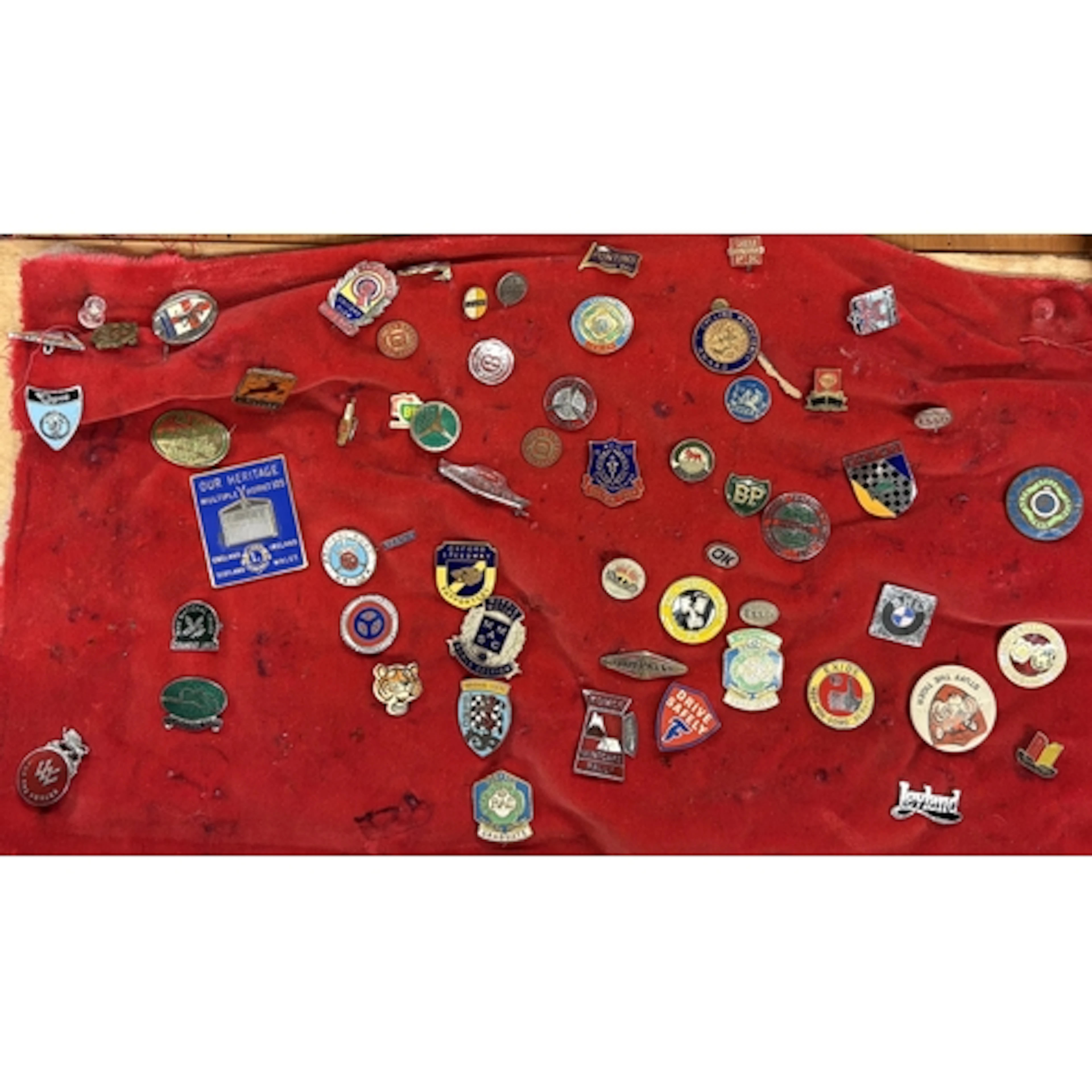 A collection of enamel motoring and other pin badges. Est. £...