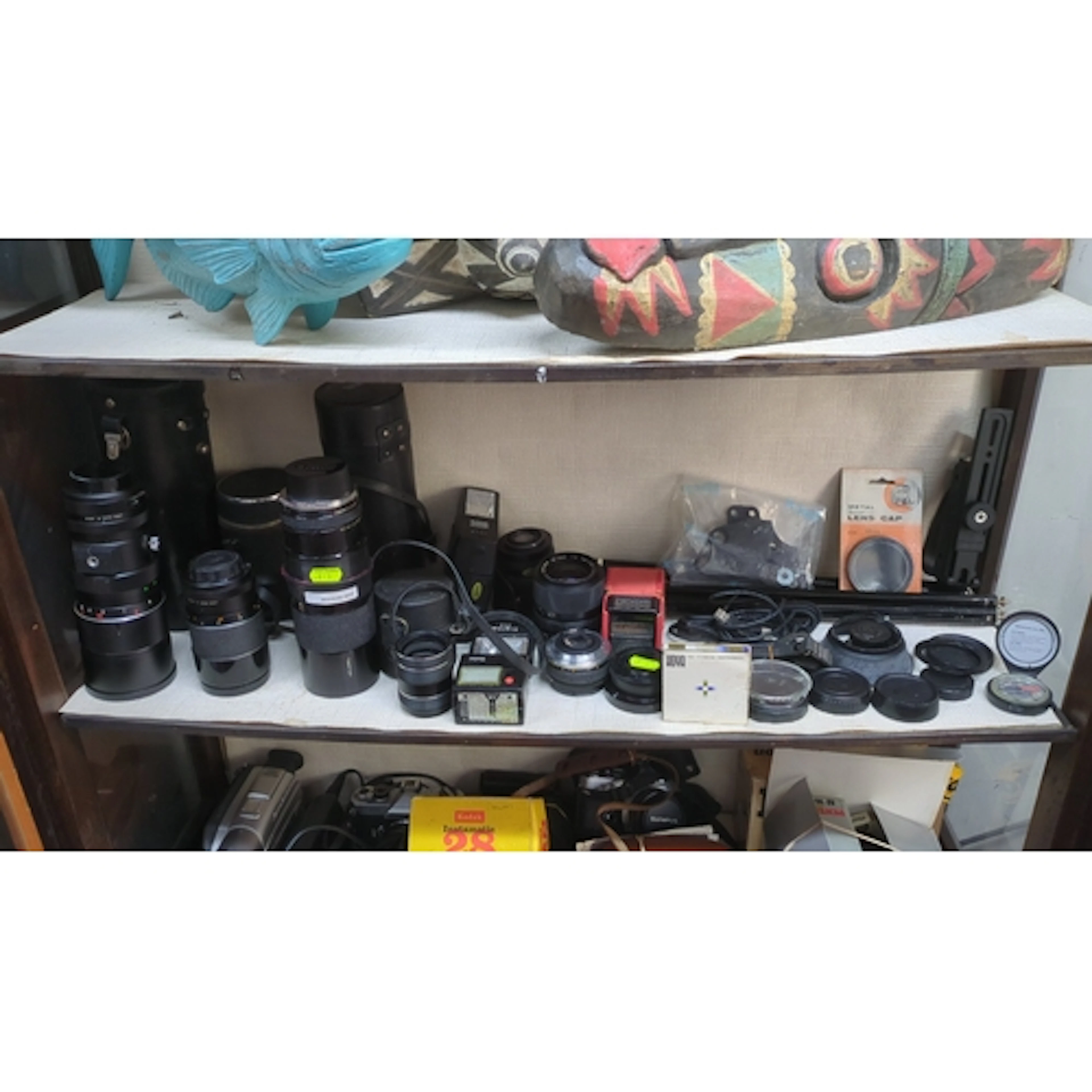 A group of vintage camera equipment, including interchangeab...