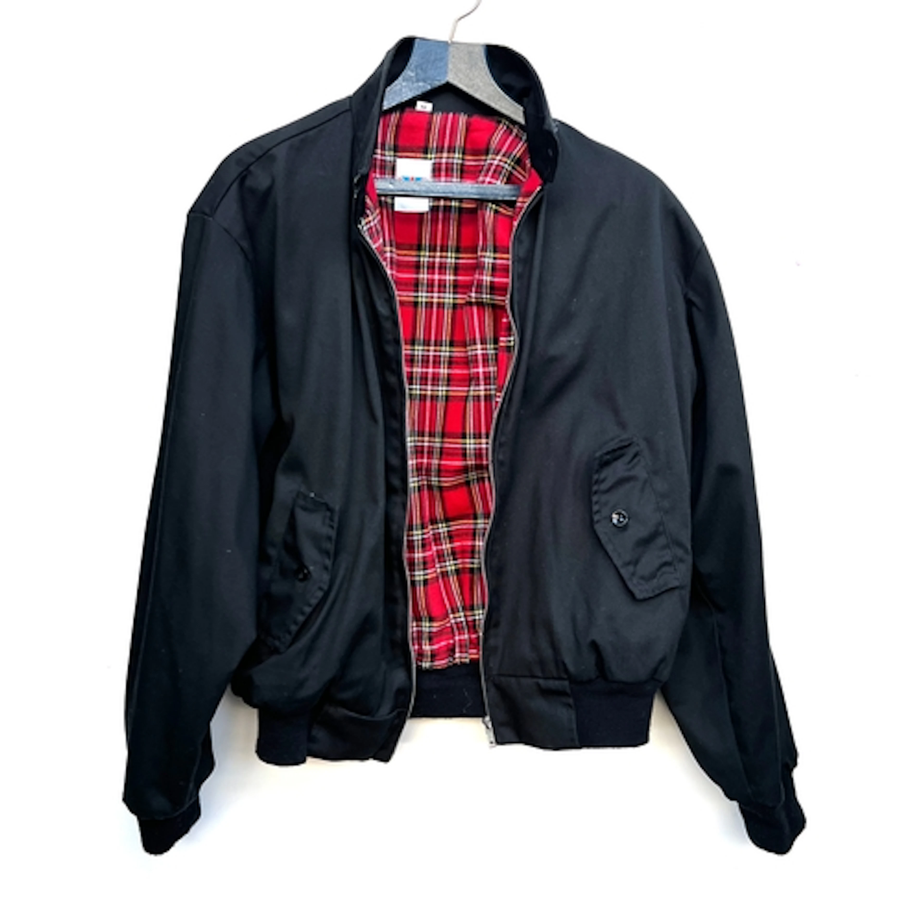 A black cotton blend Harrington jacket with tartan lining, s...