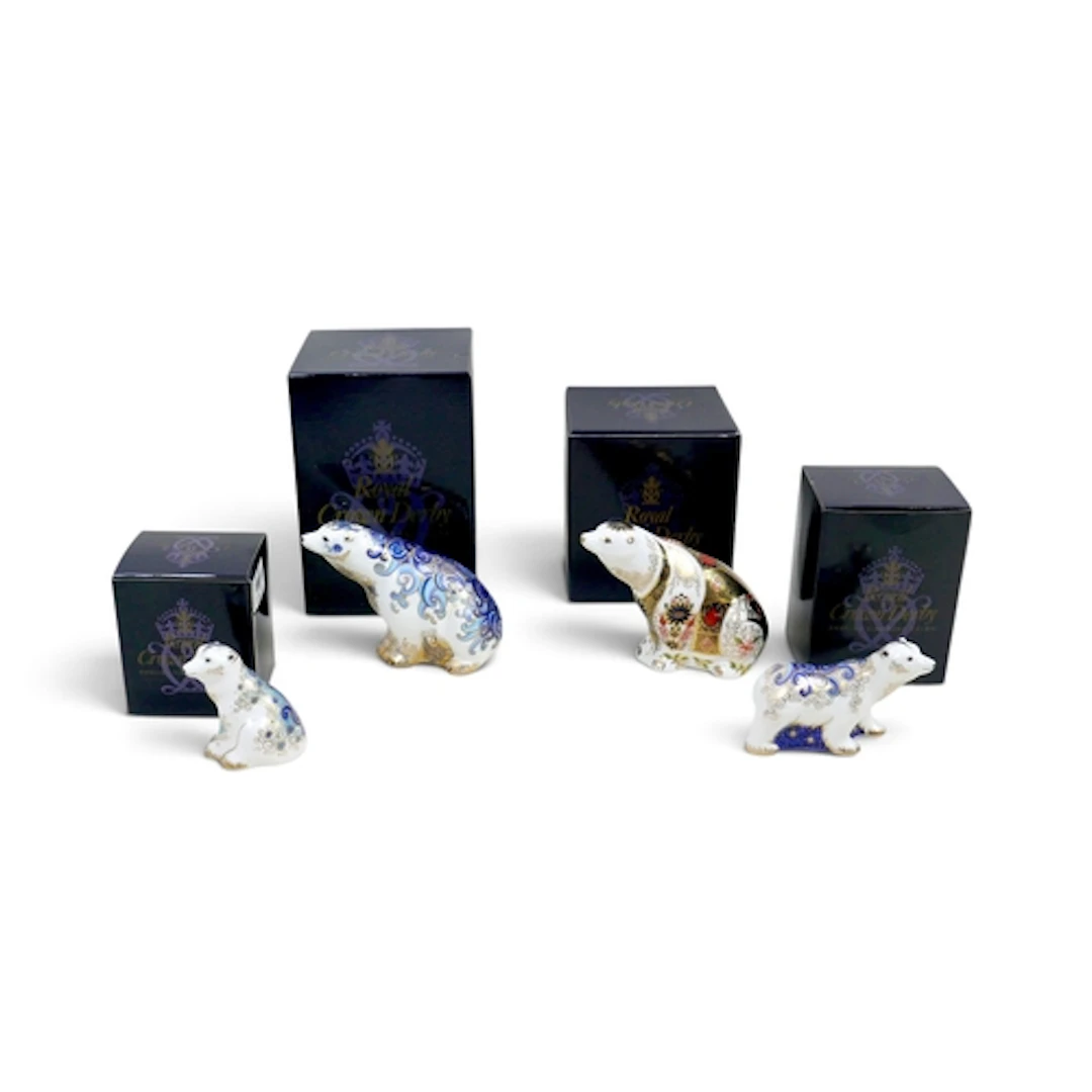 FOUR ROYAL CROWN DERBY POLAR BEAR PAPERWEIGHTS. including an...