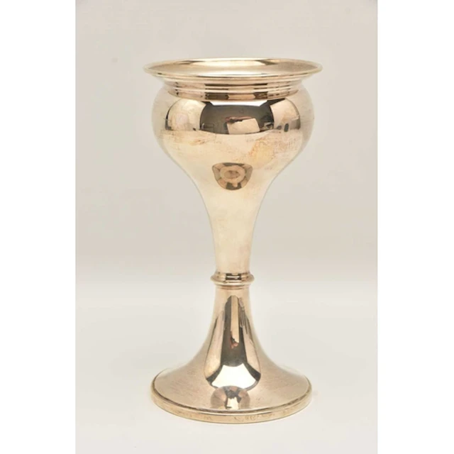 A GEORGE V SILVER BUD VASE, gilt interior with weighted roun...
