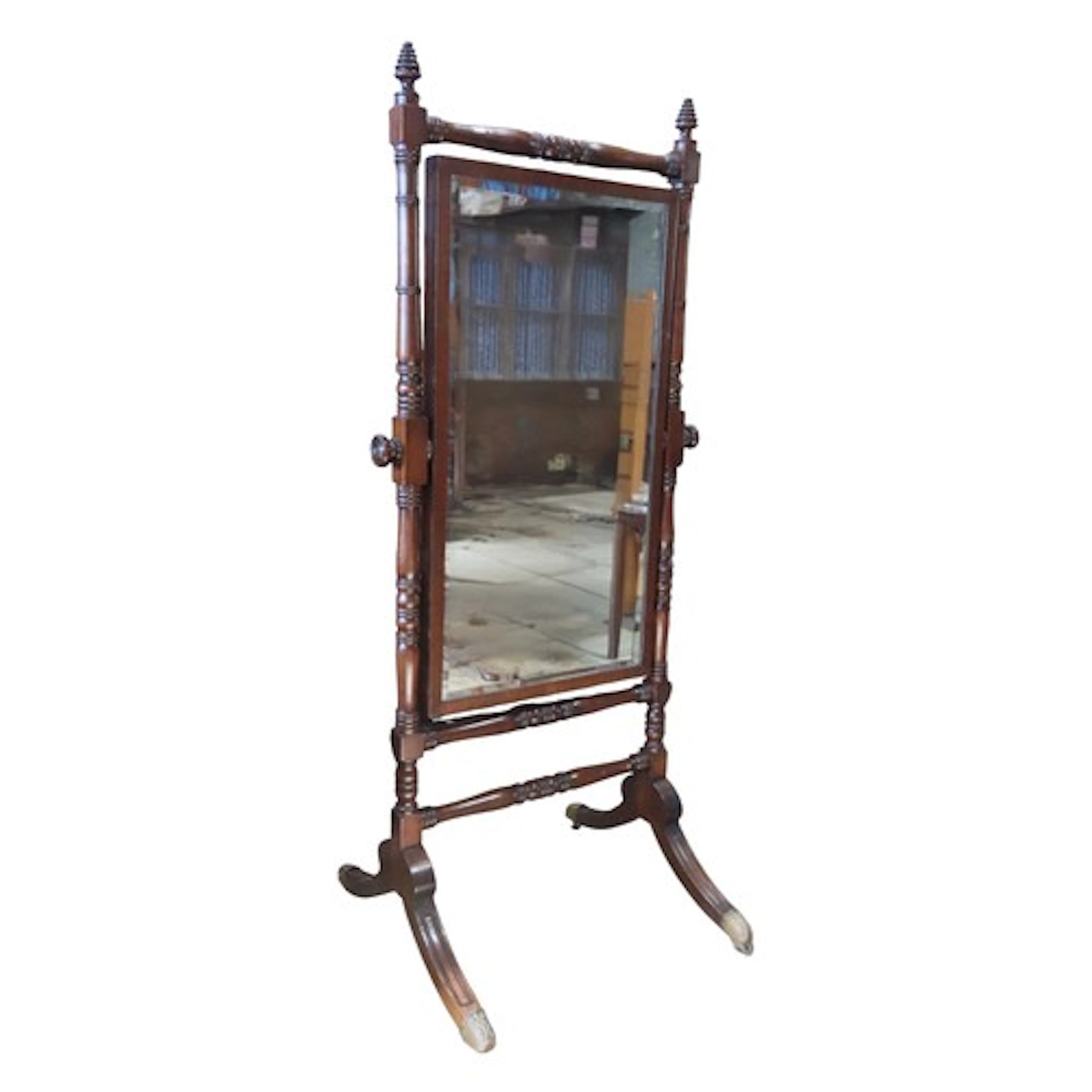 A mahogany cheval mirror, the turned framework supporting a ...