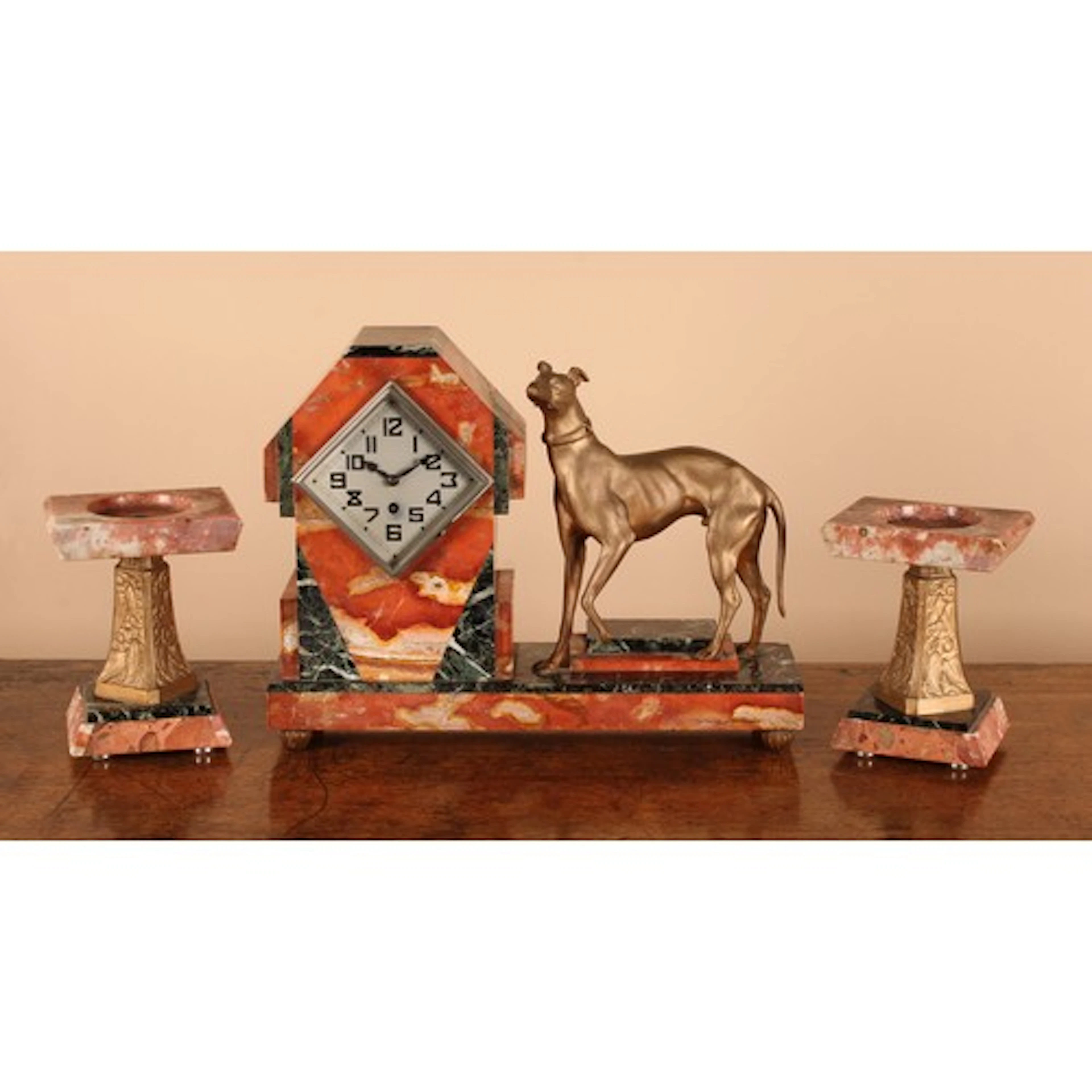An Art Deco marble and cold painted spelter figural clock ga...