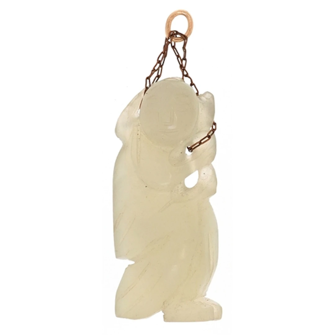 Chinese green stone pendant carved with a figure, 4.4cm high...