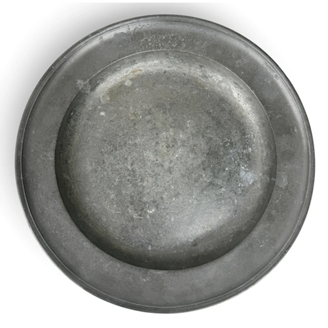 A PEWTER PLATE ENGRAVED FOR MICHAEL SADLER, 1787 35cm W...