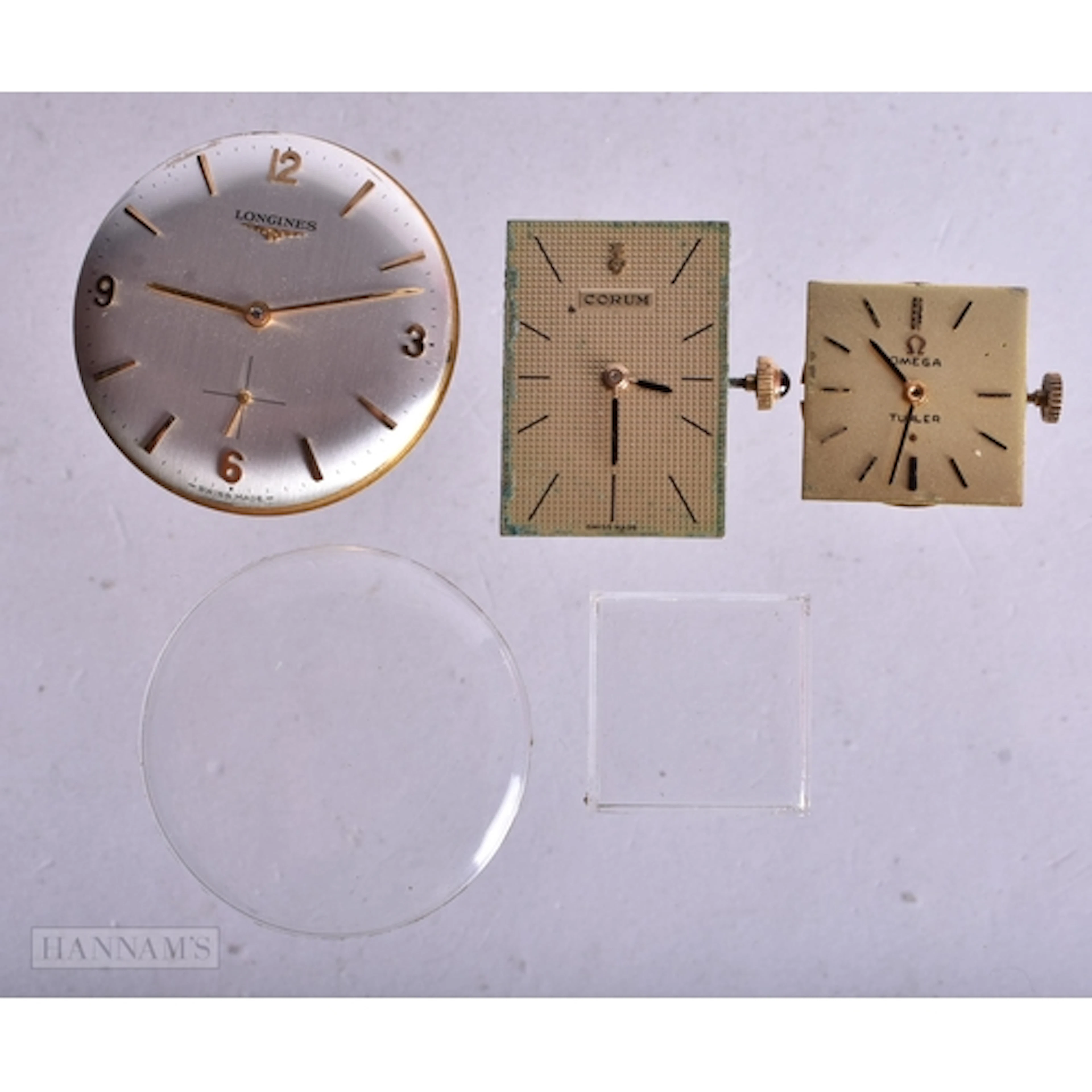 A LONGINES & CORUM WATCH MOVEMENT. Untested. 3 cm wide. (2)