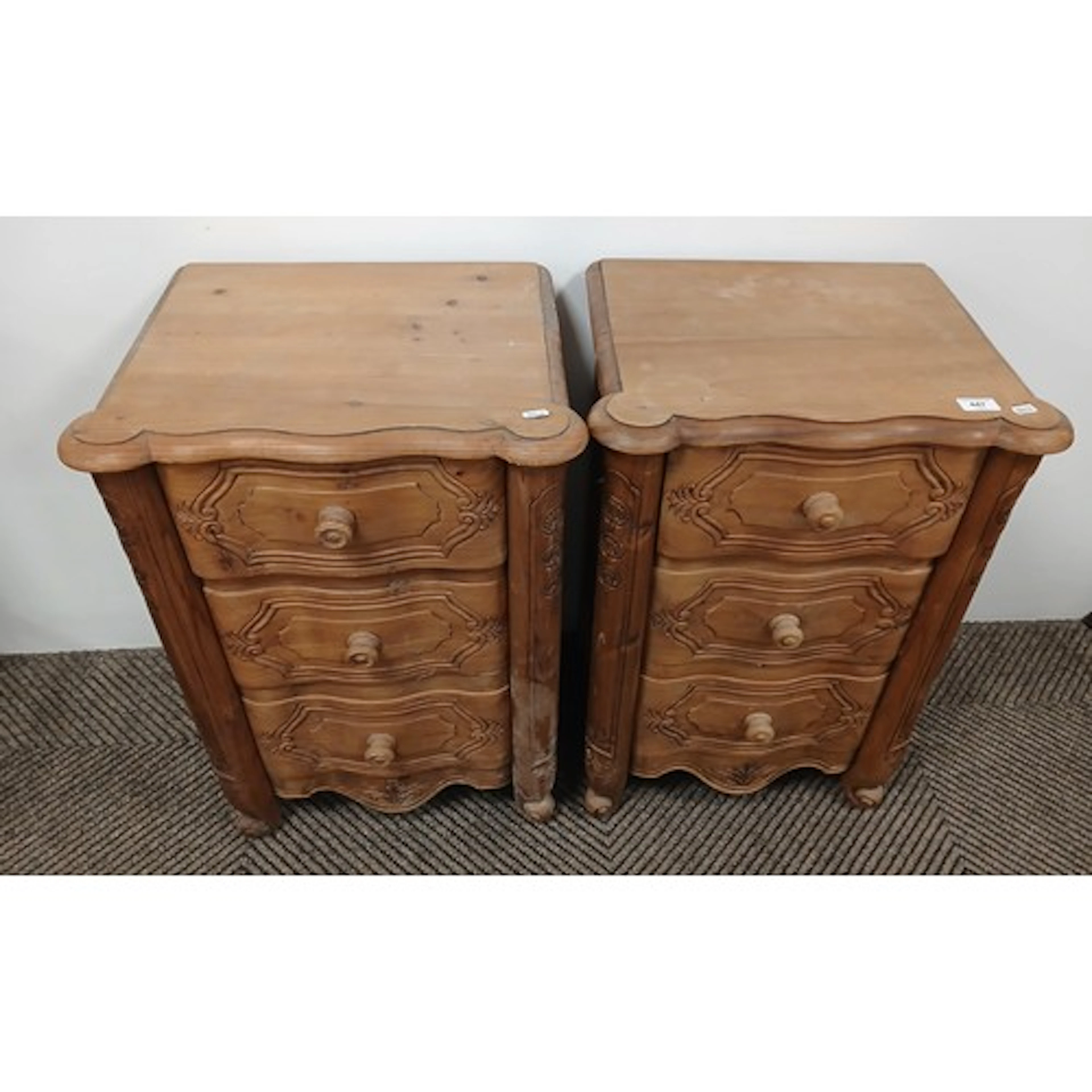 Pair of pine carved bedside chest of three drawers, each 48c...