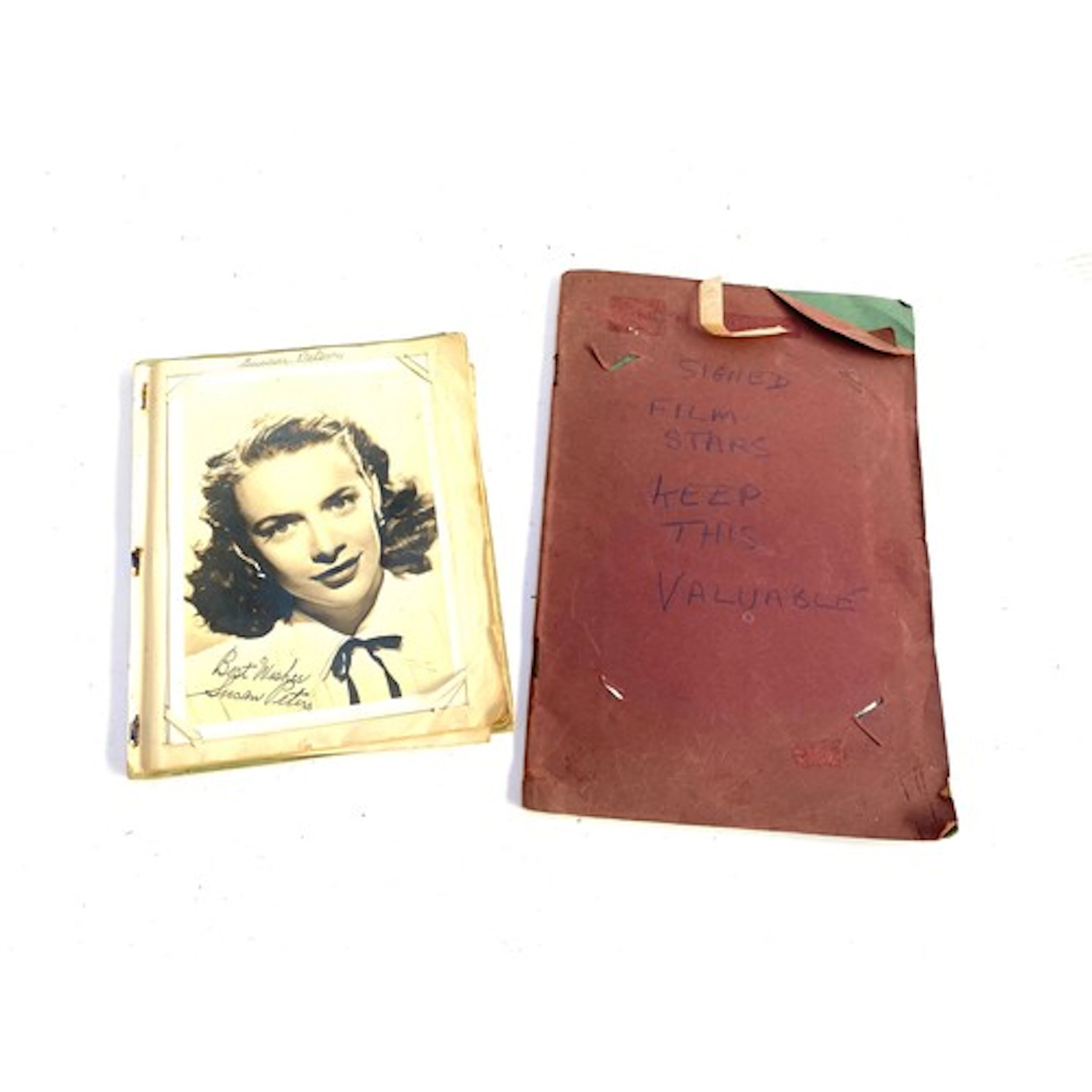 Two vintage autograph albums containing black and white sign...