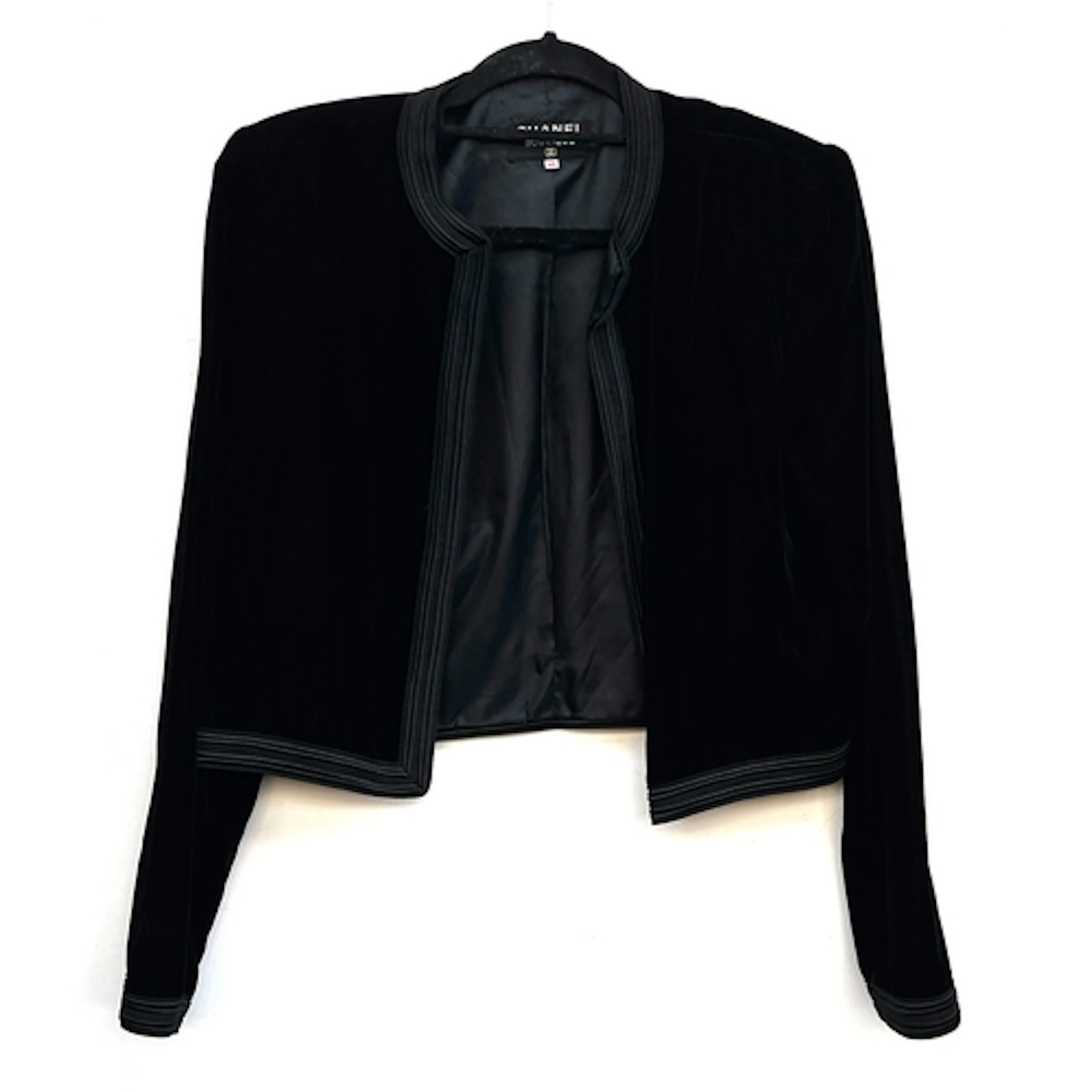 A Chanel Boutique black velvet jacket with brocade trim, siz...