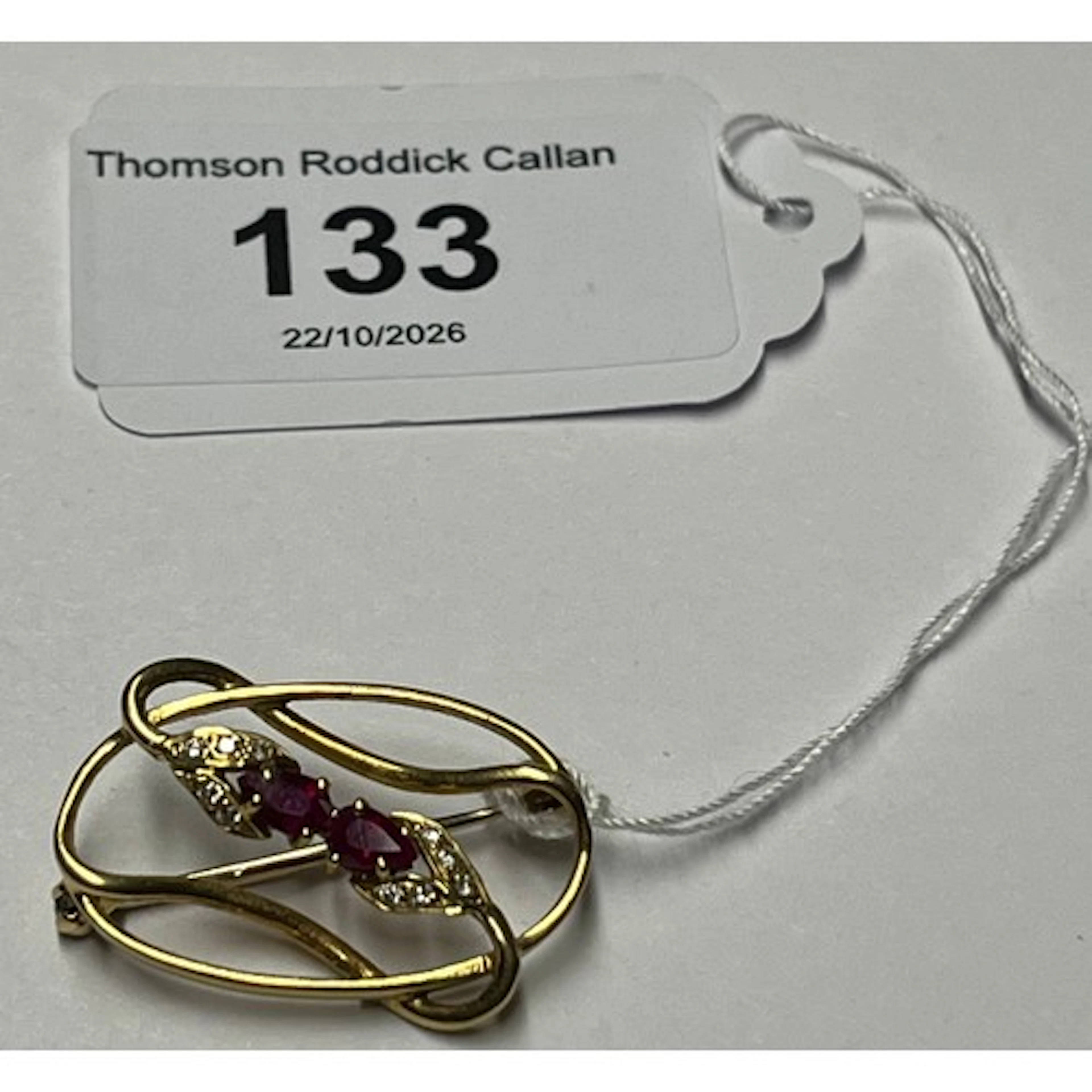 18ct gold ruby and diamond chip brooch, gross weight 4.2g.