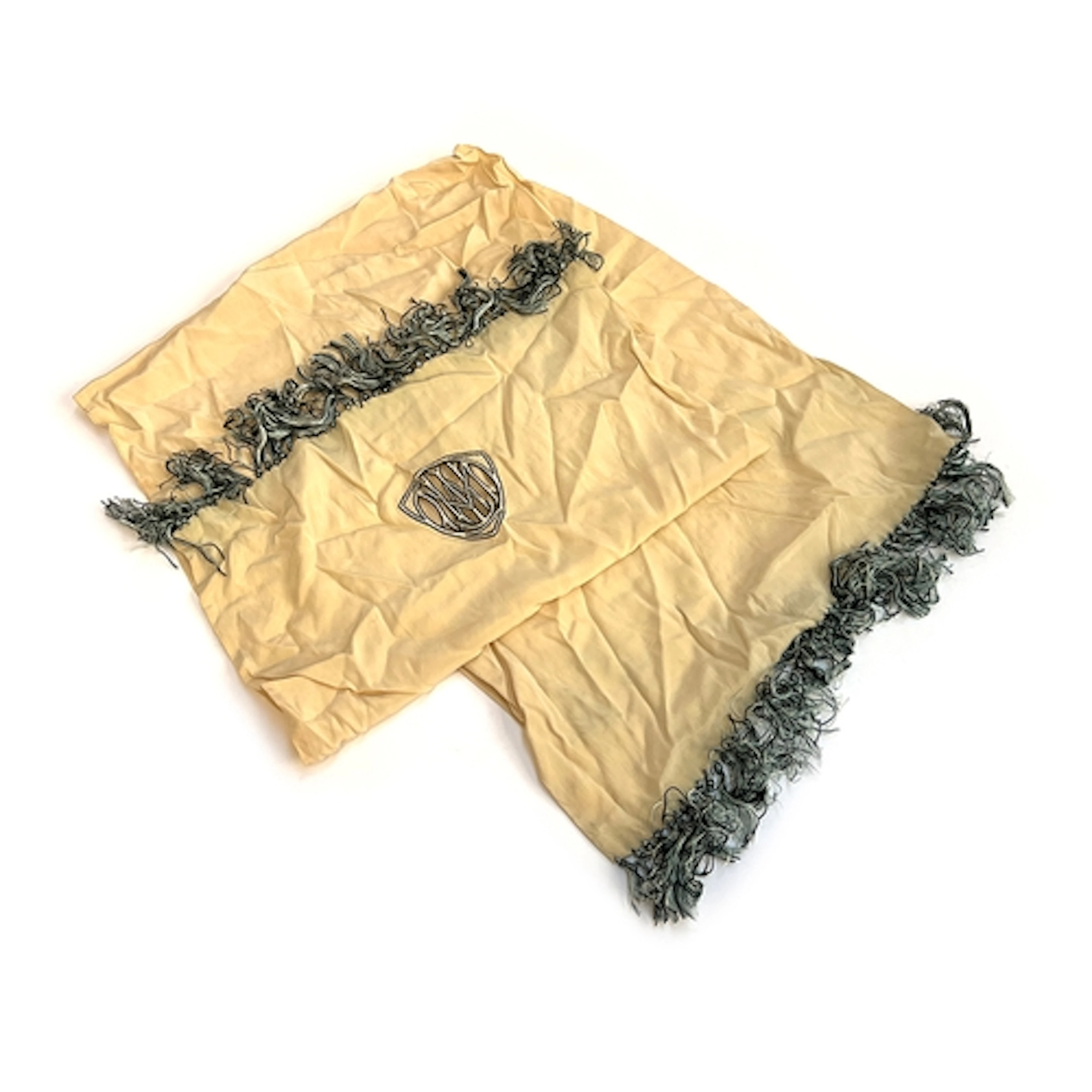 A smart silk scarf with pierced monogram and tasselled edges...