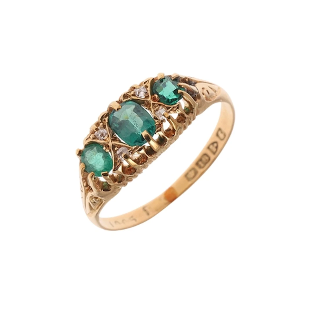 AN 18CT GOLD AND GEM SET RING. mounted with one oval-shaped ...