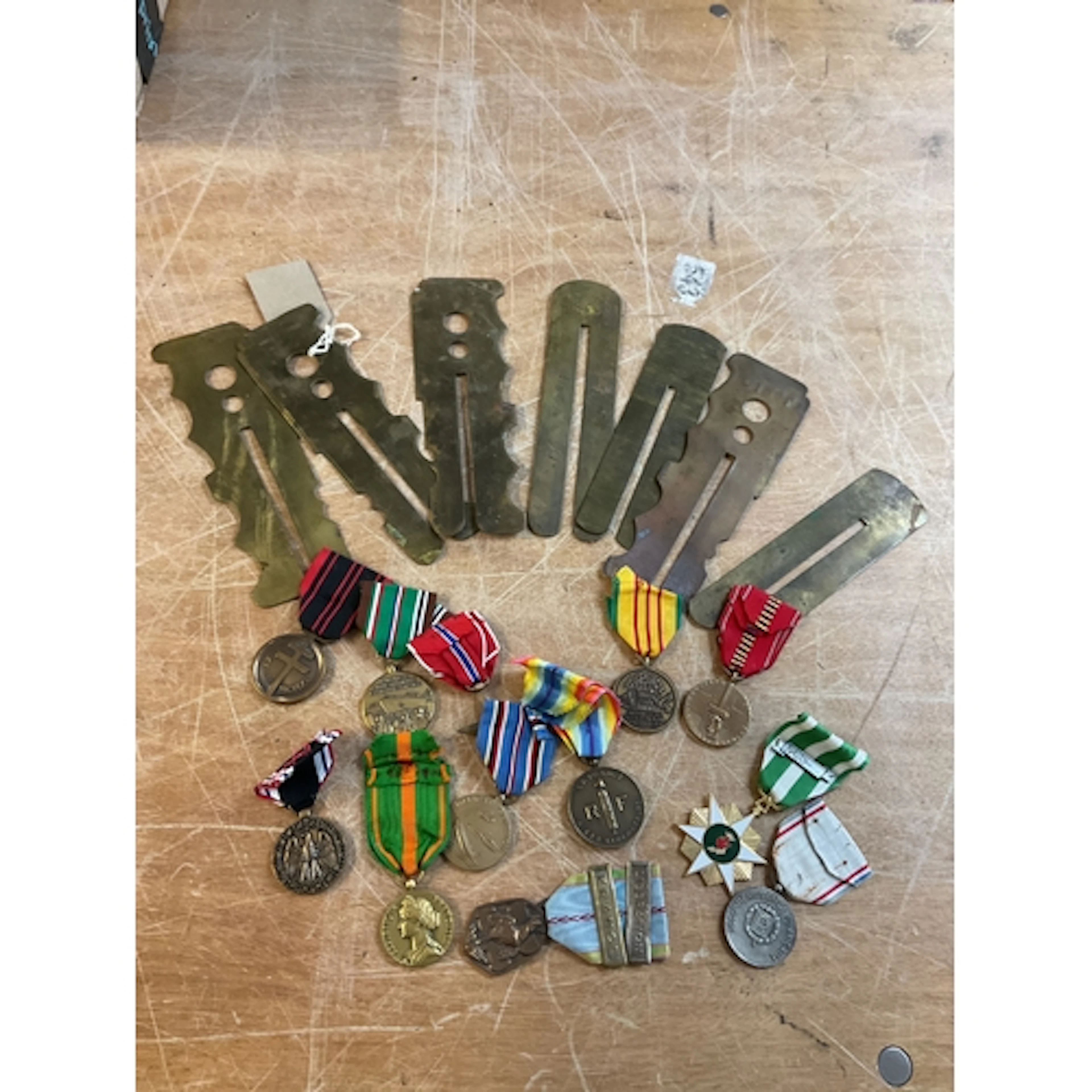 Qty brass button polishers and world medals.