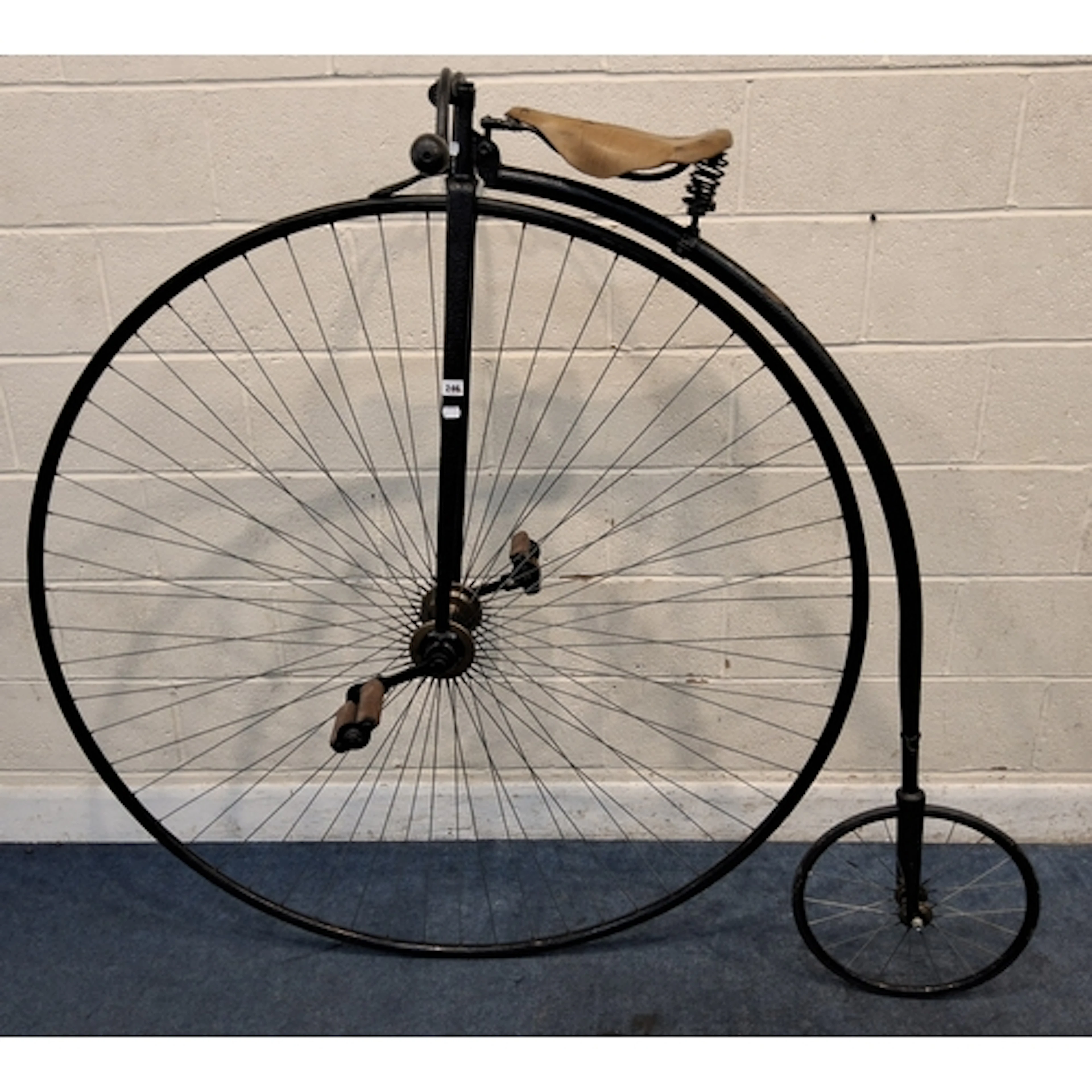A 19TH CENTURY TUBULAR IRON ORDINARY BICYCLE (Penny Farthing...